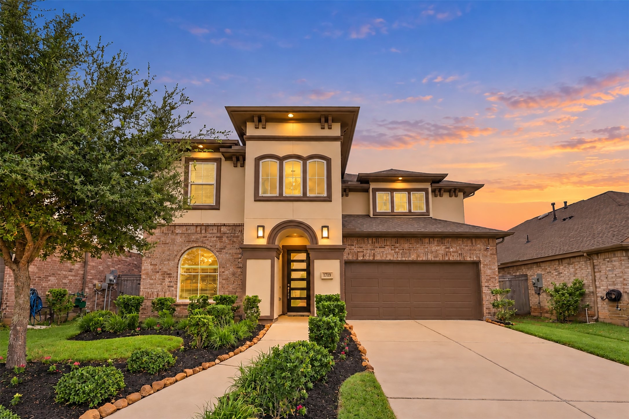 THE WOW FACTOR starts at the curb! This BREATHTAKING two-story masterpiece dazzles with its stunning brick & stucco architecture, exquisite exterior details, lush manicured landscaping & grand, inviting entry! A SPECTACULAR blend of elegance, luxury & architectural beauty! Shows like a MODEL HOME! Prepare to FALL IN LOVE!
