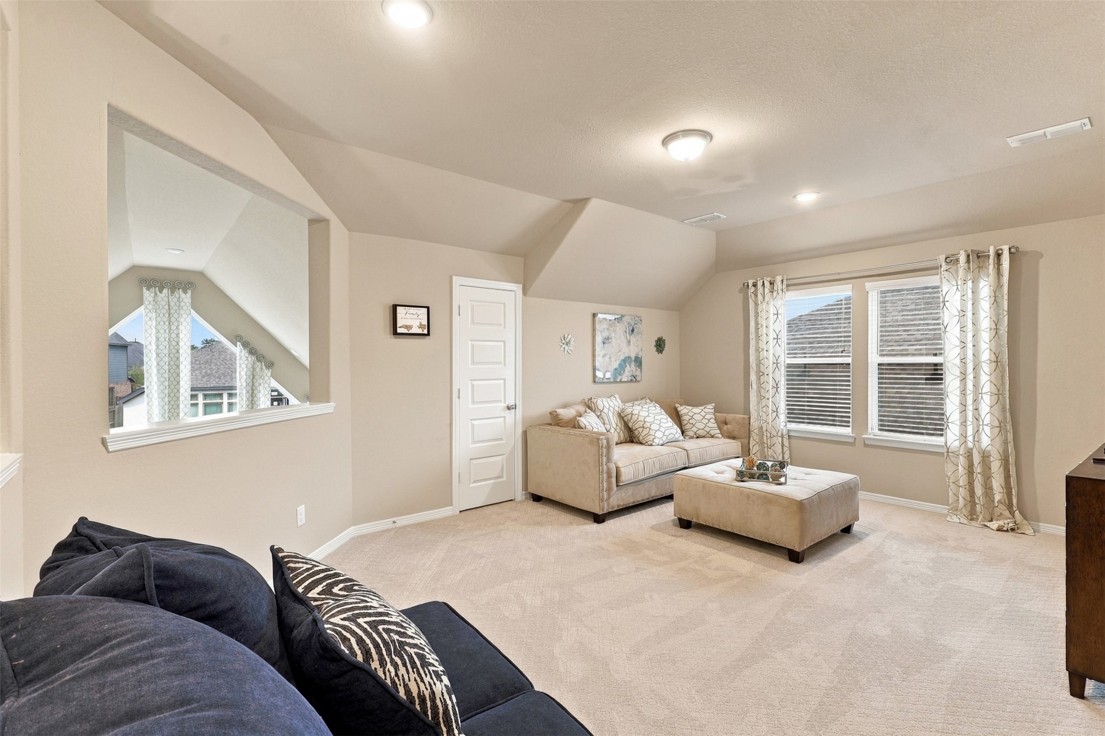 LET THE FUN & MEMORIES BEGIN! WOW! This FABULOUS upstairs GAME ROOM offers an incredible amount of space for entertaining, relaxing, and enjoying life! Imagine exciting game nights, cheering on your favorite team, or creating the ultimate second living area where everyone can gather! Beautiful large windows welcome an abundance of natural light, while the spacious, versatile layout offers endless possibilities for comfortable seating, games, and entertainment! WAIT.. there's MORE! A wonderful WALK-IN CLOSET