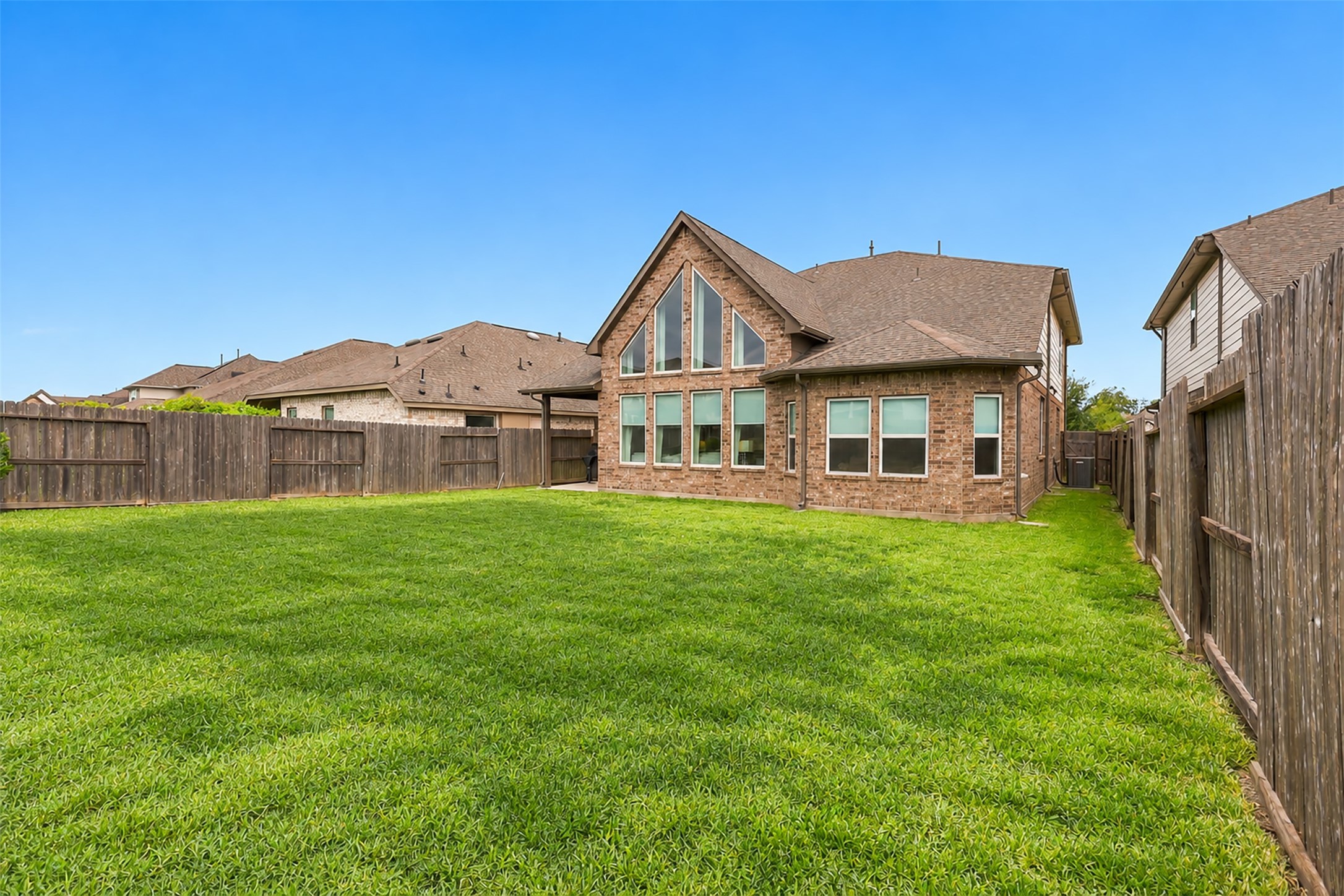 WOW! THE BACKYARD YOU'VE BEEN DREAMING OF! Step outside and imagine the ENDLESS POSSIBILITIES this fabulous, spacious backyard has to offer! A beautiful stretch of lush green lawn surrounded by privacy fencing creates the PERFECT setting for outdoor entertaining, weekend barbecues, family fun, and your furry friends to play! Imagine designing your very own BACKYARD PARADISE with beautiful landscaping, an outdoor entertaining area, or MAYBE EVEN THAT SPARKLING SWIMMING POOL YOU'VE ALWAYS WANTED!