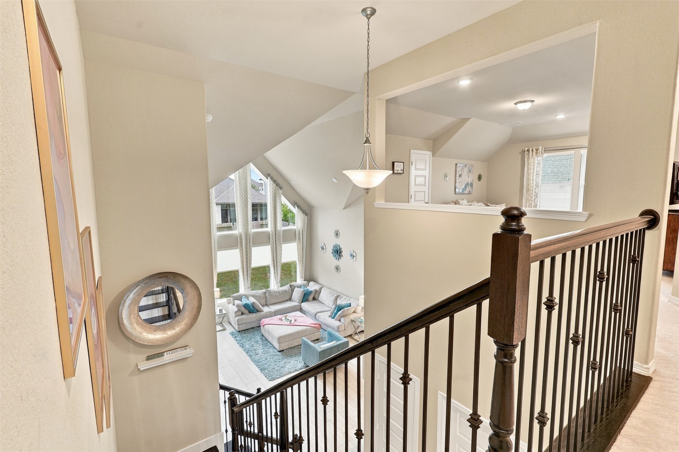 Elegant open railings overlook the STUNNING two-story family room below, where soaring ceilings and impressive walls of windows create an unforgettable WOW FACTOR! Natural light fills this incredible open space, showcasing the home's timeless elegance and grand design! Follow the RIGHT WING and discover the FABULOUS PRIVATE MEDIA ROOM and More!