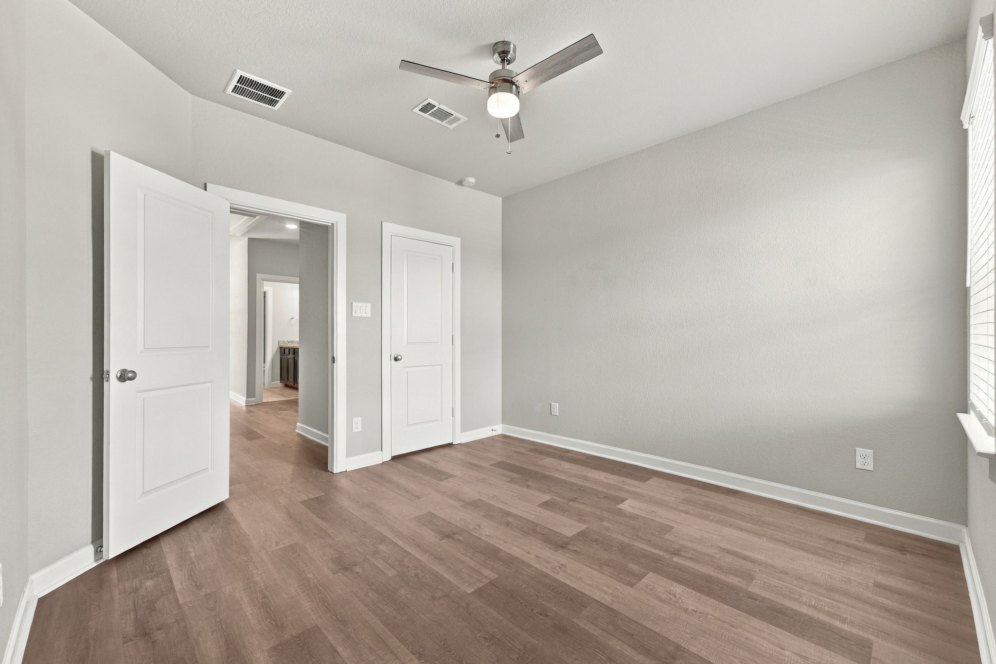 Another bedroom, another closet, steps from a full bath. Every corner of this house works.