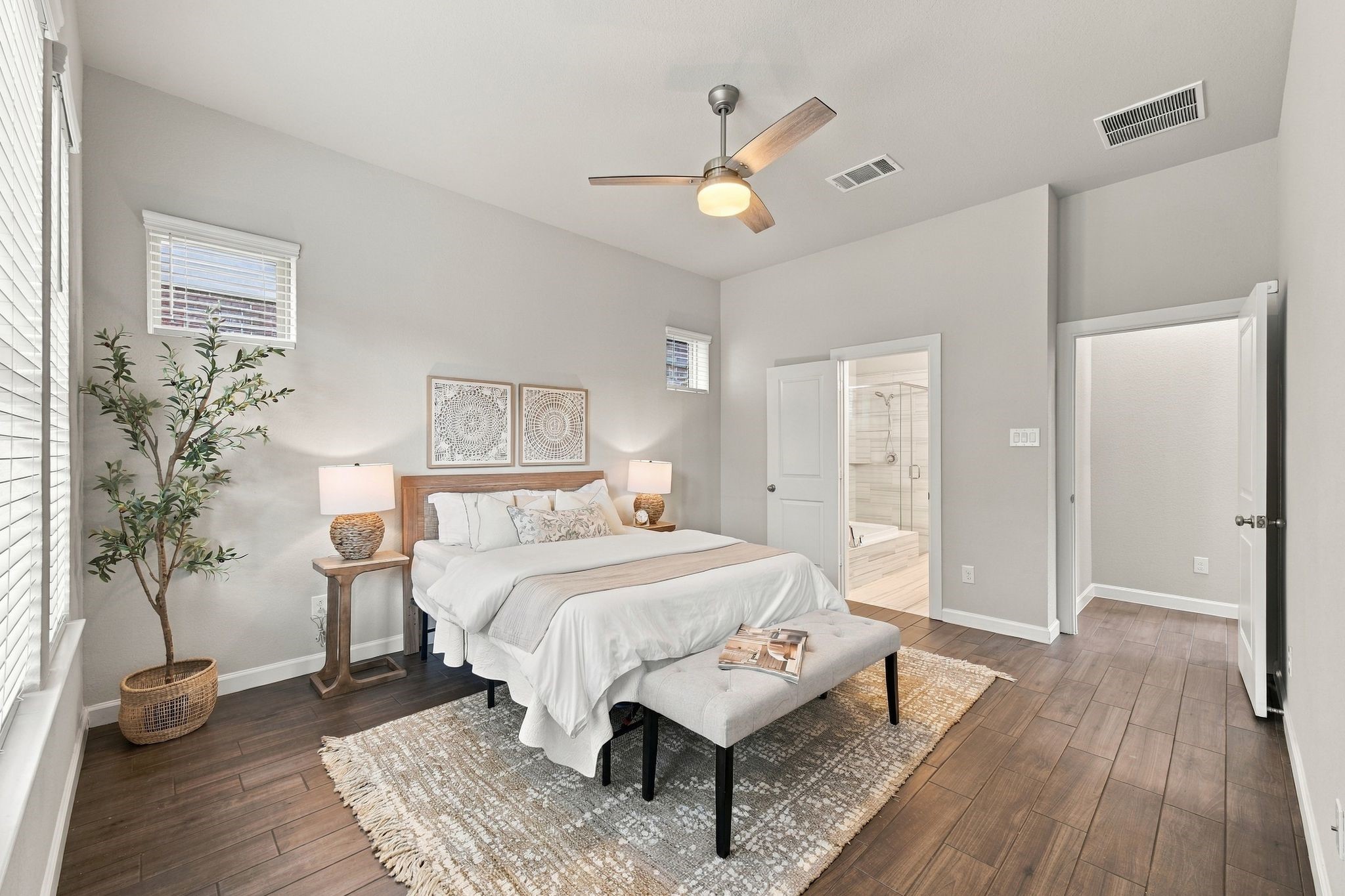 The primary suite opens straight to the ensuite bath, soaking tub included.