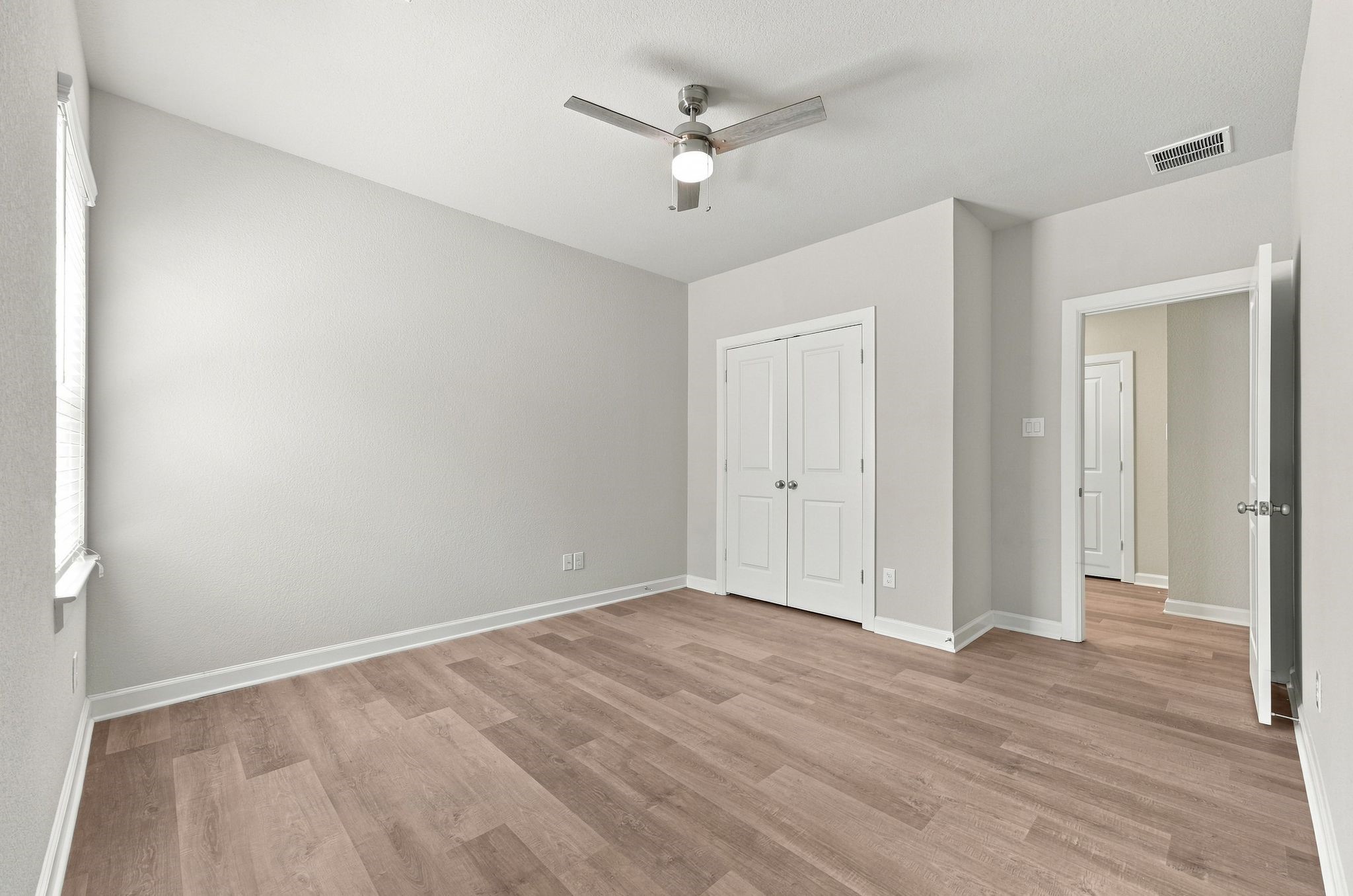 Room to grow, a closet built in, and light from every angle.