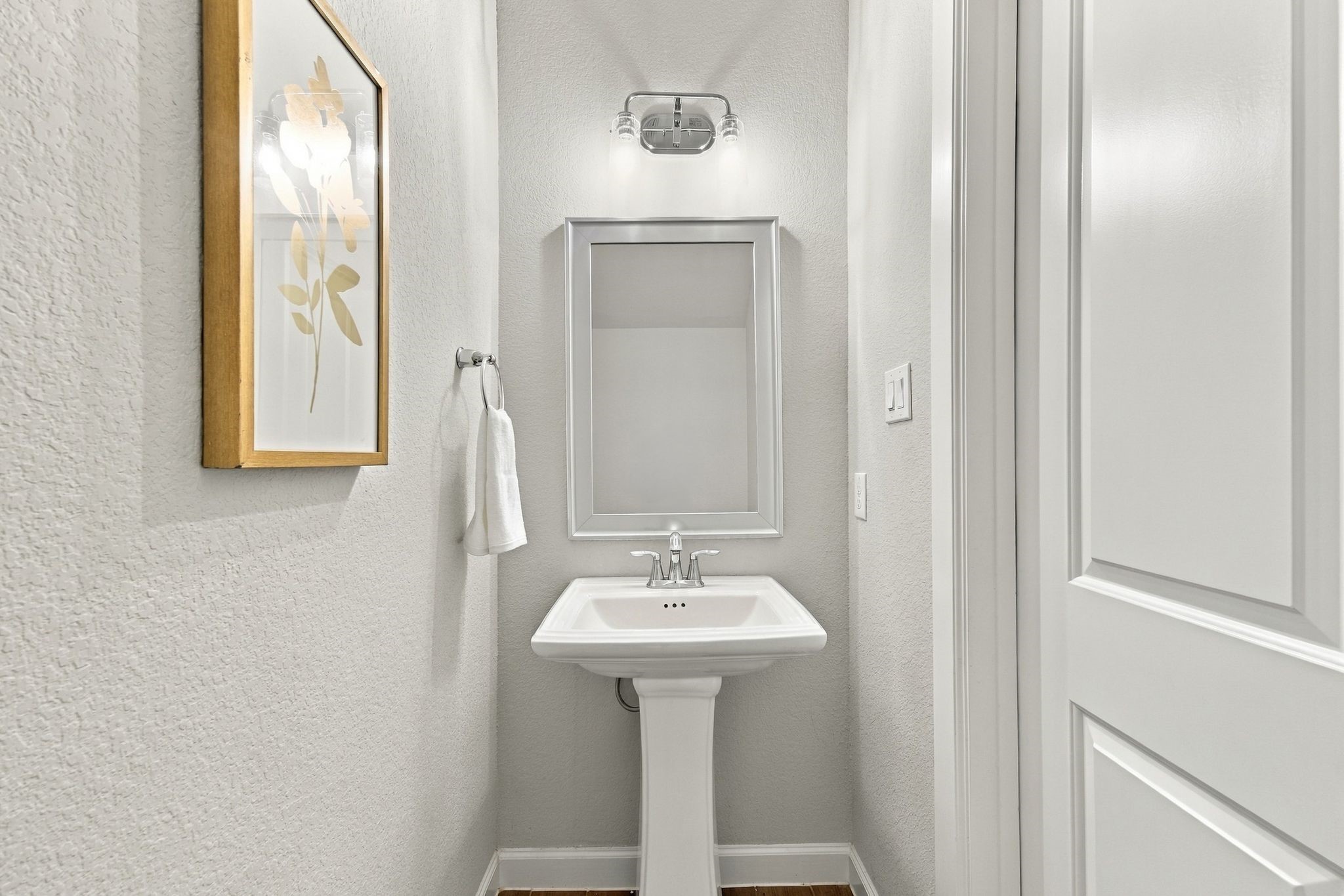 A powder room finished for guests, not an afterthought.