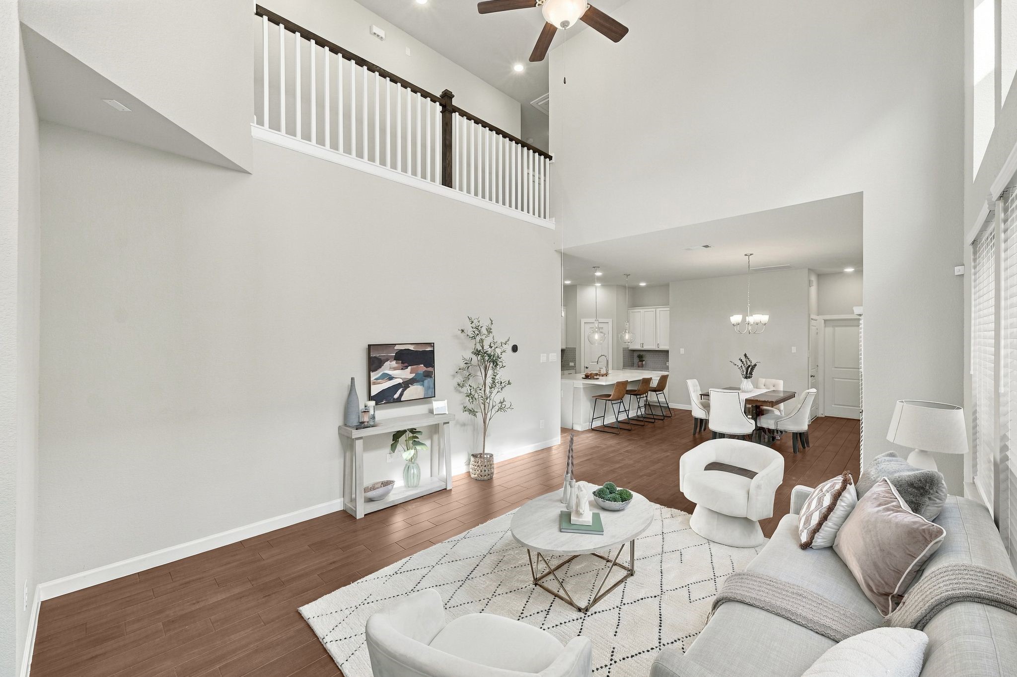 Kitchen, living room, and loft share one continuous space. That is luxury done right.