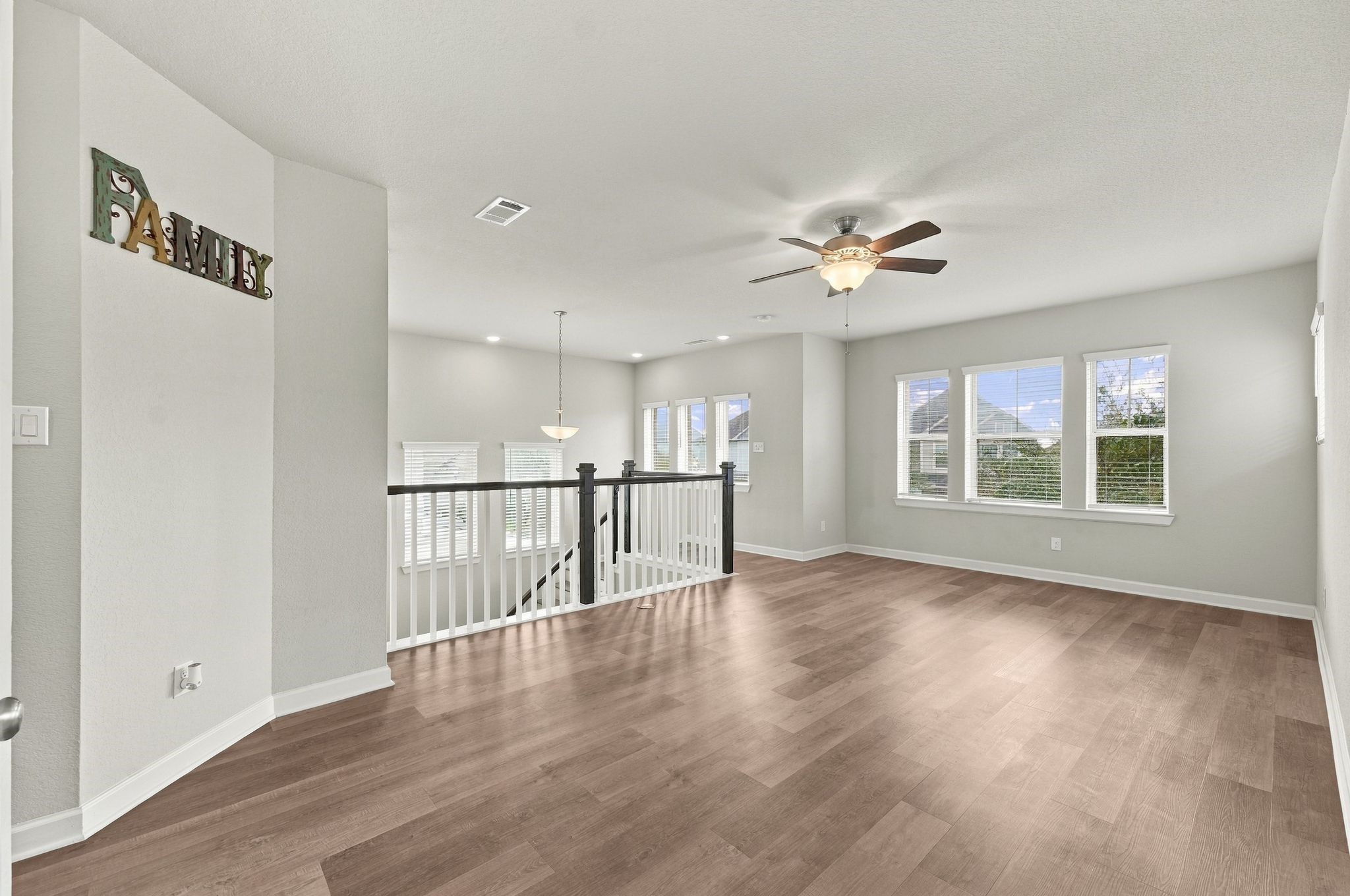 A blank canvas upstairs, ready for game night, movie night, or whatever the family decides it needs to be.