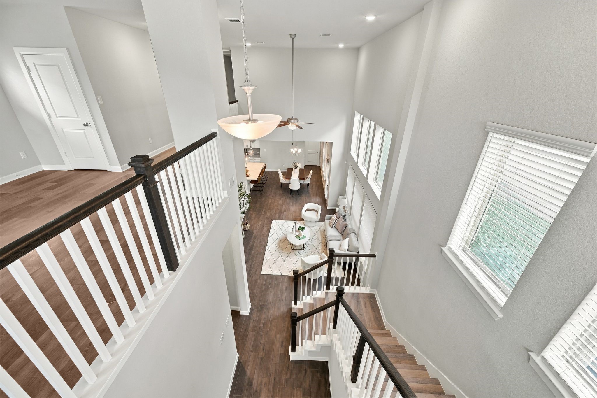 Two stories, one open conversation from the top of the stairs to the front door.