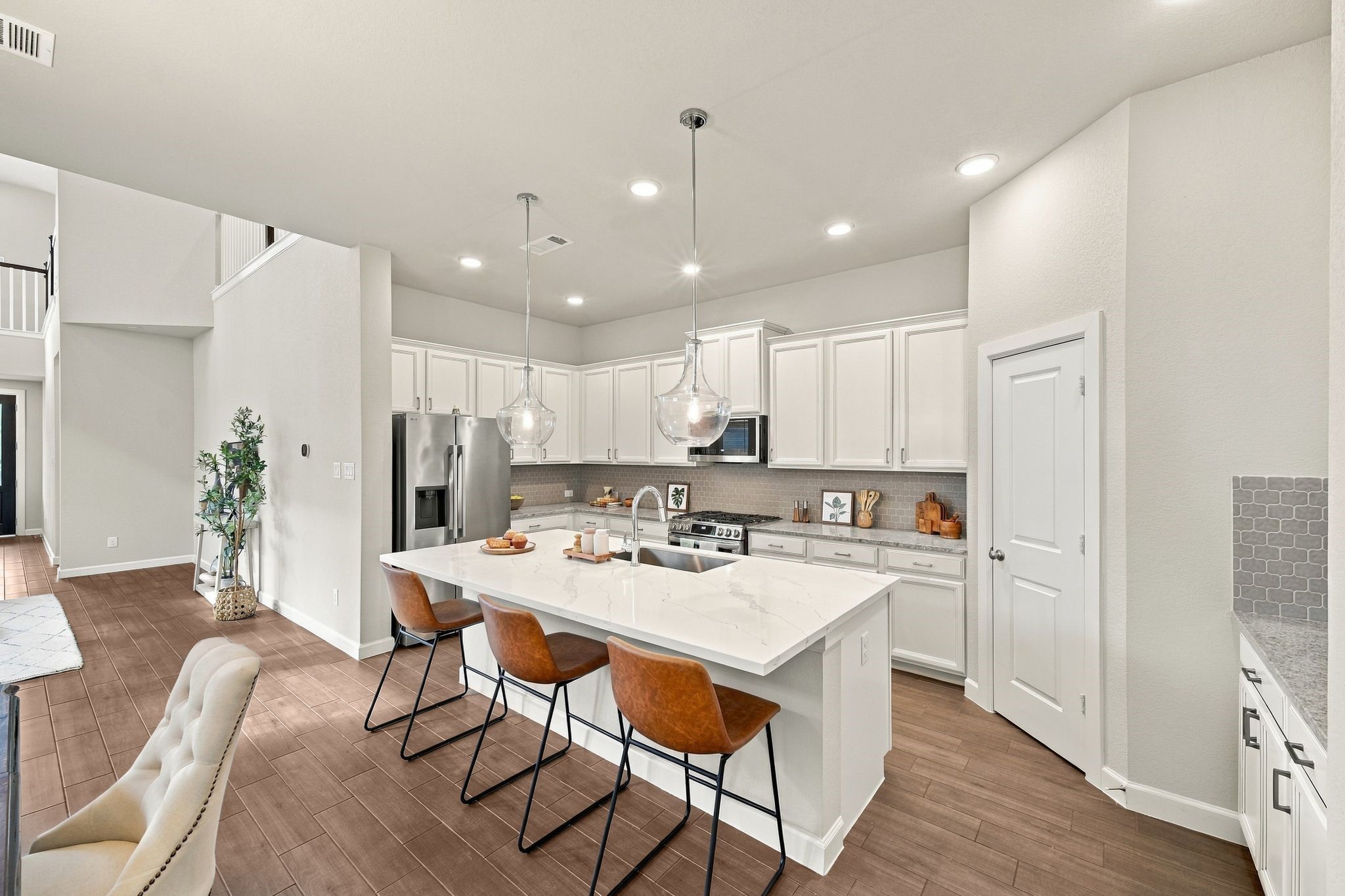 Granite counters, stainless appliances, pendant lighting. Everyday cooking, elevated.