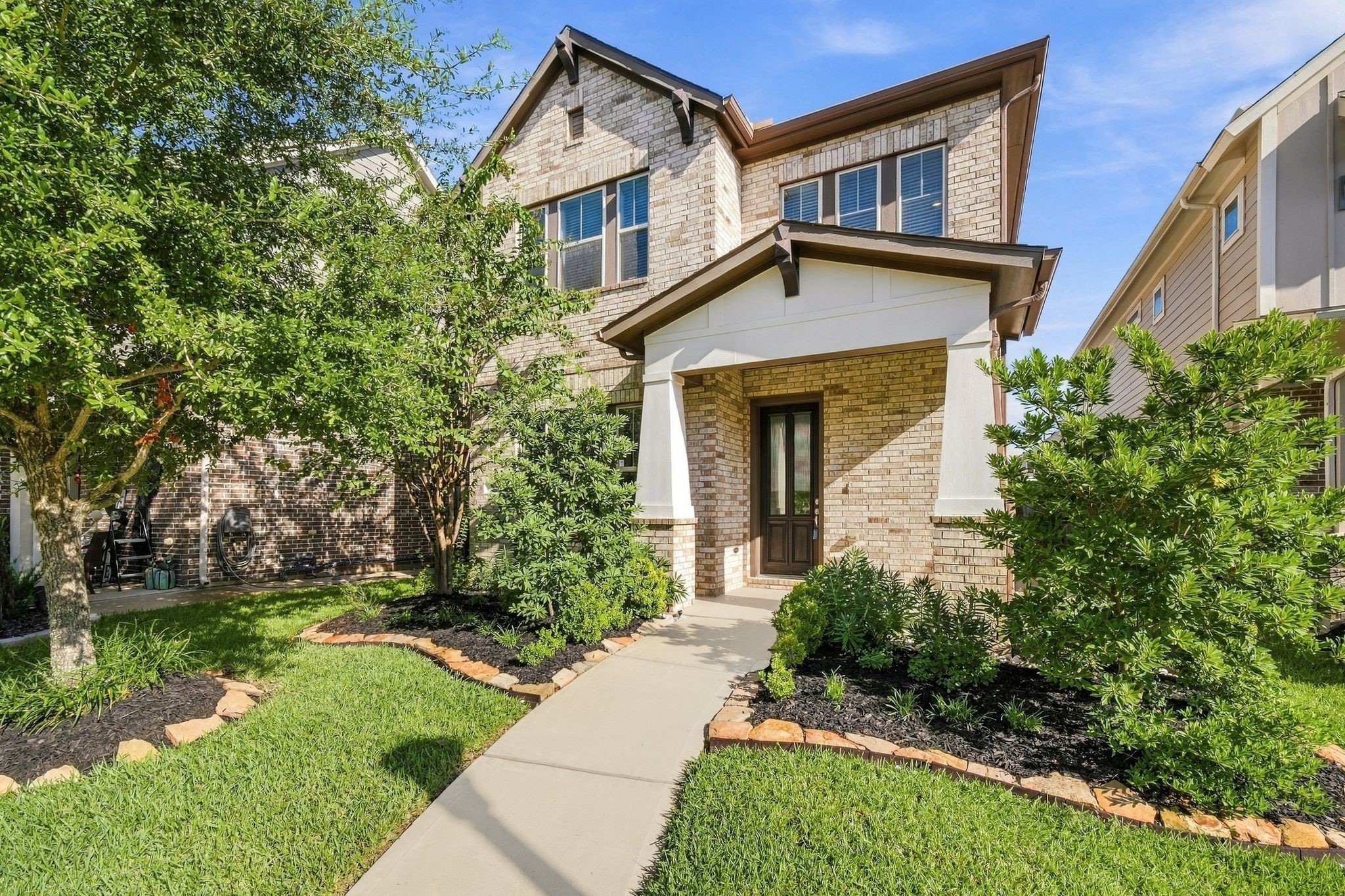 Four bedrooms, two full baths, a half bath, and a two car garage sit behind a gated address zoned to top rated KISD schools.