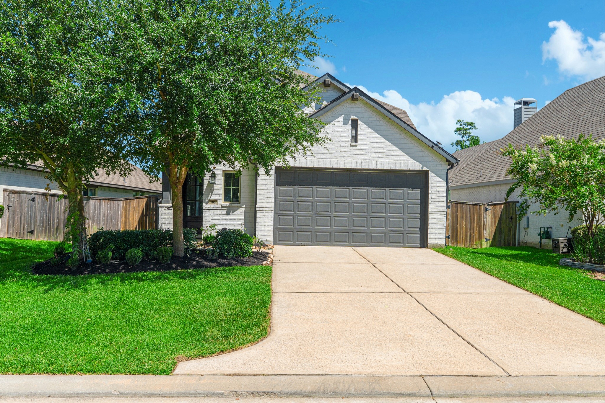 Street-level view of this beautiful home that is ready now for immediate move in in one of North Houston highly rated master planned communities - Grand Central Park.