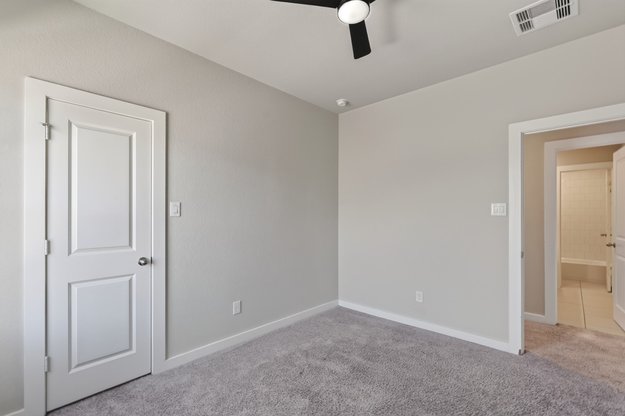 Secondary bedroom with plush carpet, a ceiling fan, and a closet  neutral walls and quality finishes make this room move-in ready and easy to personalize. A warm and comfortable space perfectly suited for family, guests, or flexible everyday household use.
