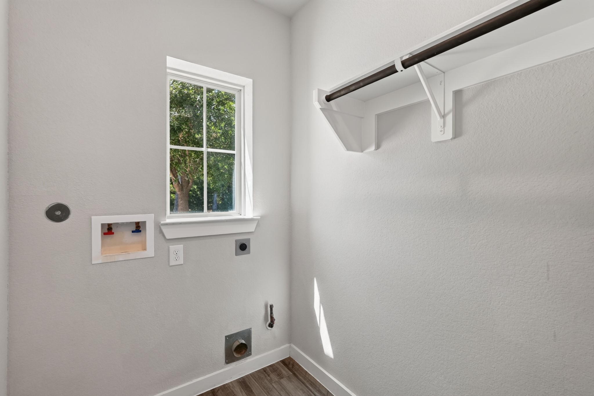 Additional bathroom or utility space featuring a window for natural light  clean, bright, and well-maintained. Functional neutral finishes and easy-care surfaces make this space both practical for daily use and a natural complement to the home's overall layout.