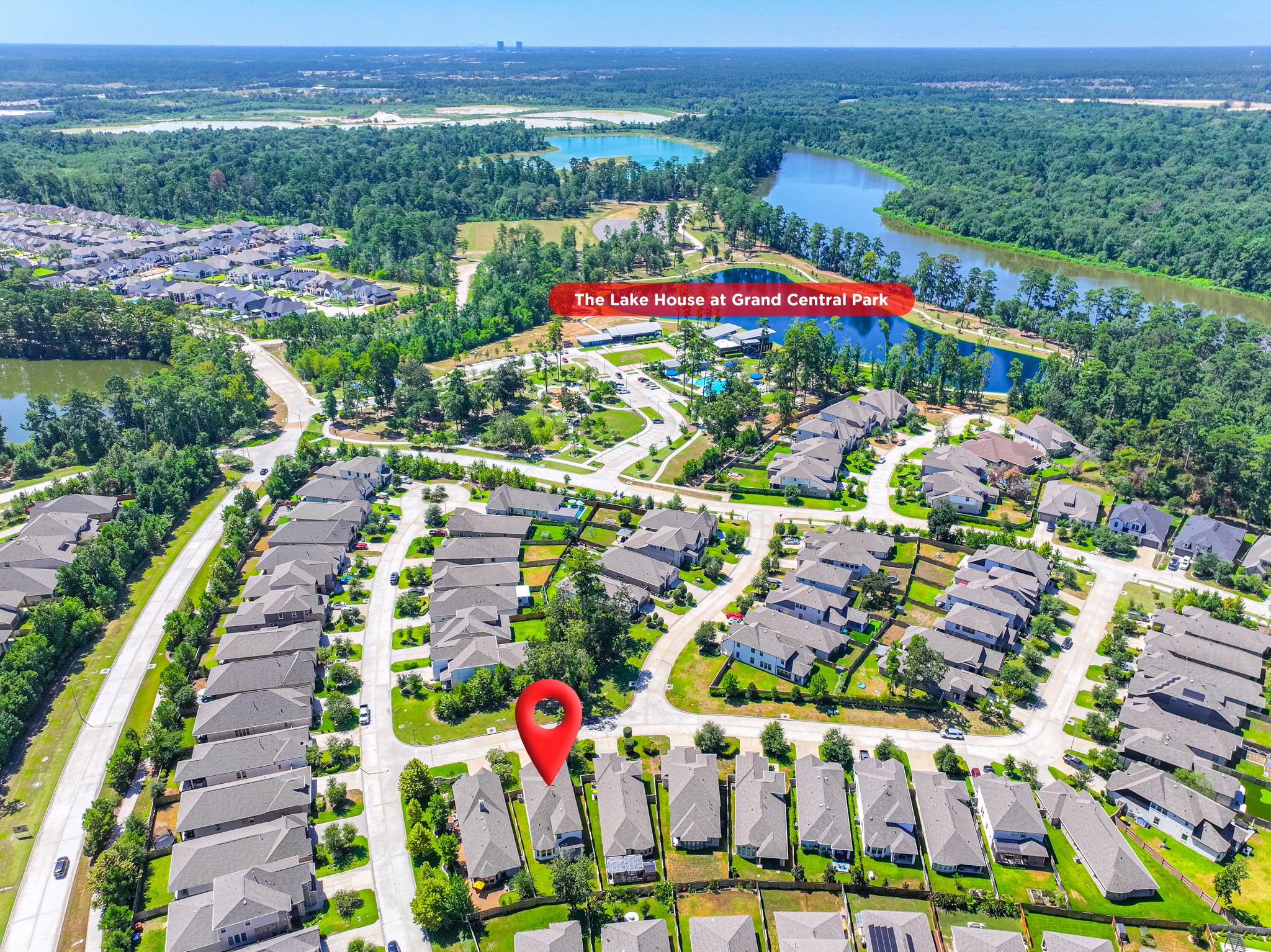 Aerial map pinpointing 706 Santa Elena Trail's prime location within Grand Central Park  one of Montgomery County's most sought-after master-planned communities, just minutes from the scenic 88-acre Grand Lake, walking trails, parks, and top amenities.