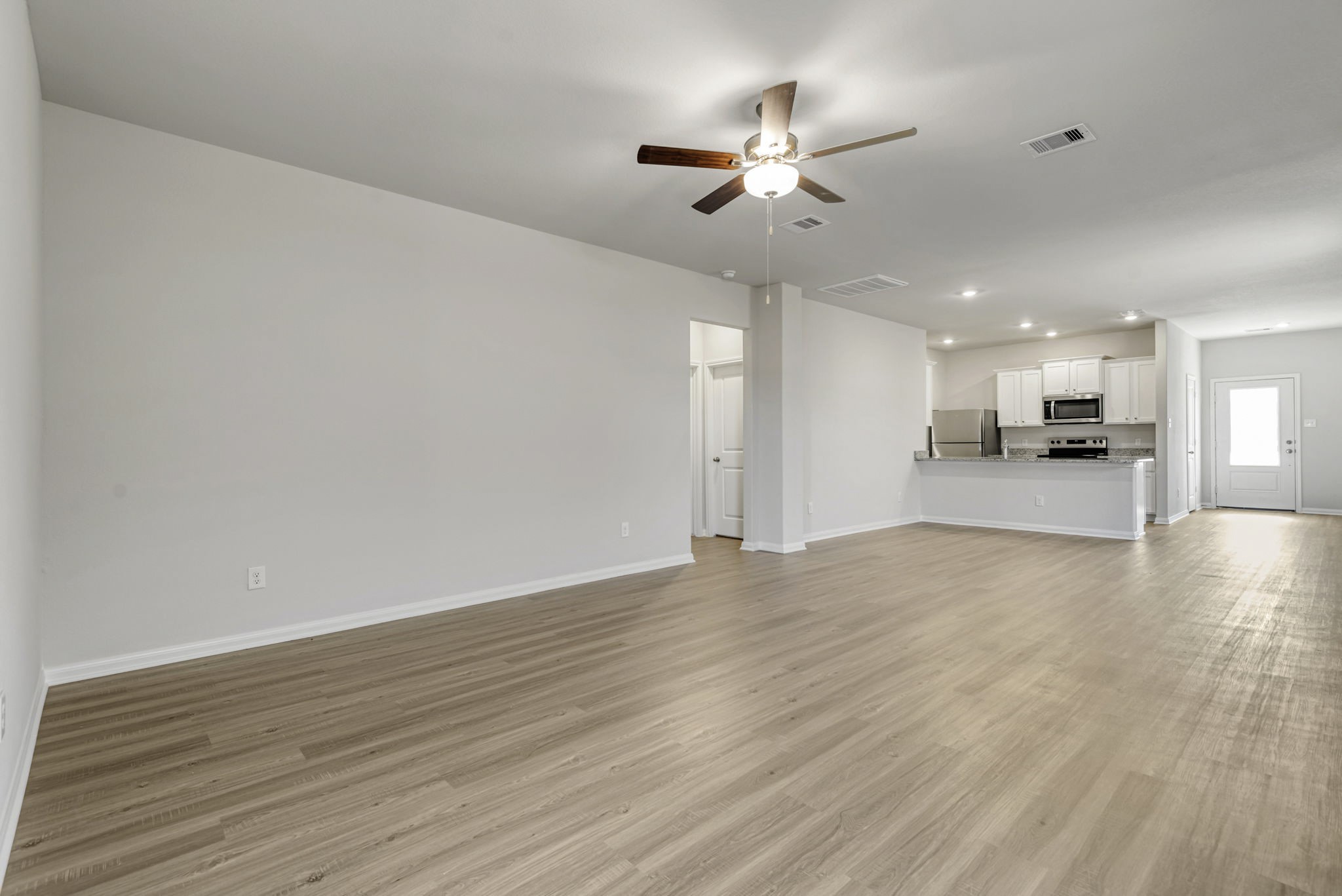 The open concept in the living room offers plenty of space to gather with your family and friends. The open concept in the living room offers plenty of space to gather with your family and friends.