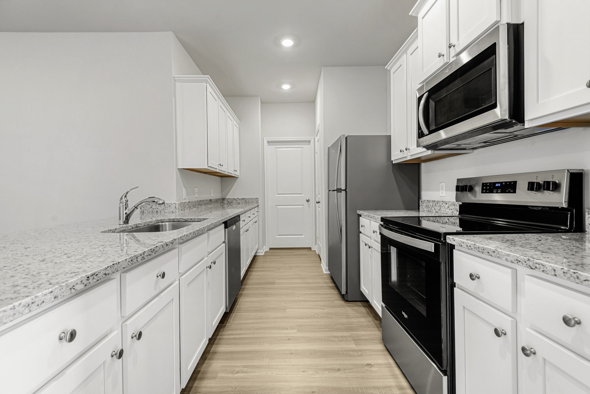 Whirlpool kitchen appliances and granite countertops make this kitchen chef-ready! Whirlpool kitchen appliances and granite countertops make this kitchen chef-ready!