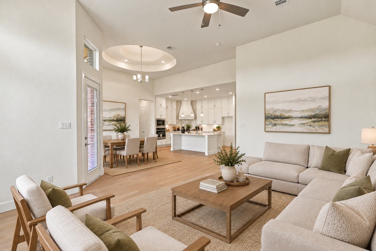 OPEN-CONCEPT LIVING AT ITS FINEST! Prepare to FALL IN LOVE with this spacious family room that flows beautifully into the dining area and gourmet kitchen! Soaring ceilings, recessed lighting, and gorgeous engineered wood flooring create a bright, inviting atmosphere! The seamless layout makes entertaining and everyday living a DELIGHT! **Photo is Virtually Staged**