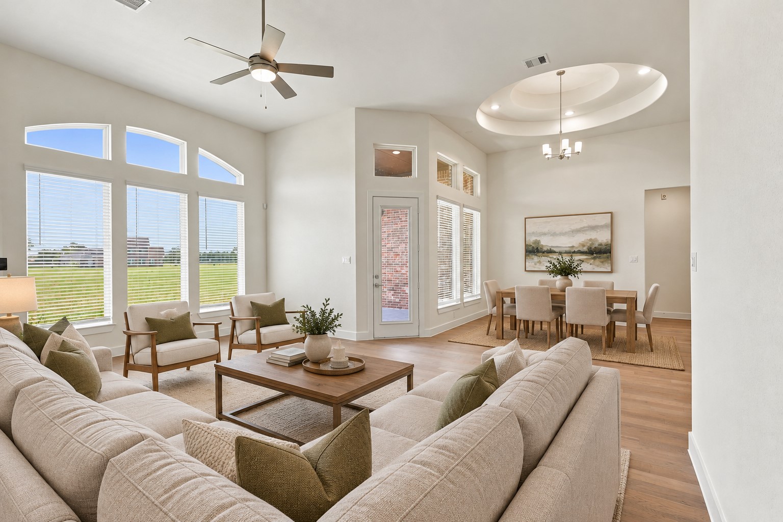 Prepare to be AMAZED by the BREATHTAKING SOARING CEILINGS and SPECTACULAR DESIGNER WINDOWS that fill this beautiful home with an abundance of NATURAL LIGHT! Notice the GORGEOUS WOOD FLOORING flowing gracefully from the family room into the inviting casual dining area, creating a seamless space for entertaining and everyday living! And there's MORE! These BEAUTIFUL INSULATED VINYL WINDOWS are designed for ENERGY EFFICIENCY, helping provide year-round comfort and potential utility saving! Virtual Staged!