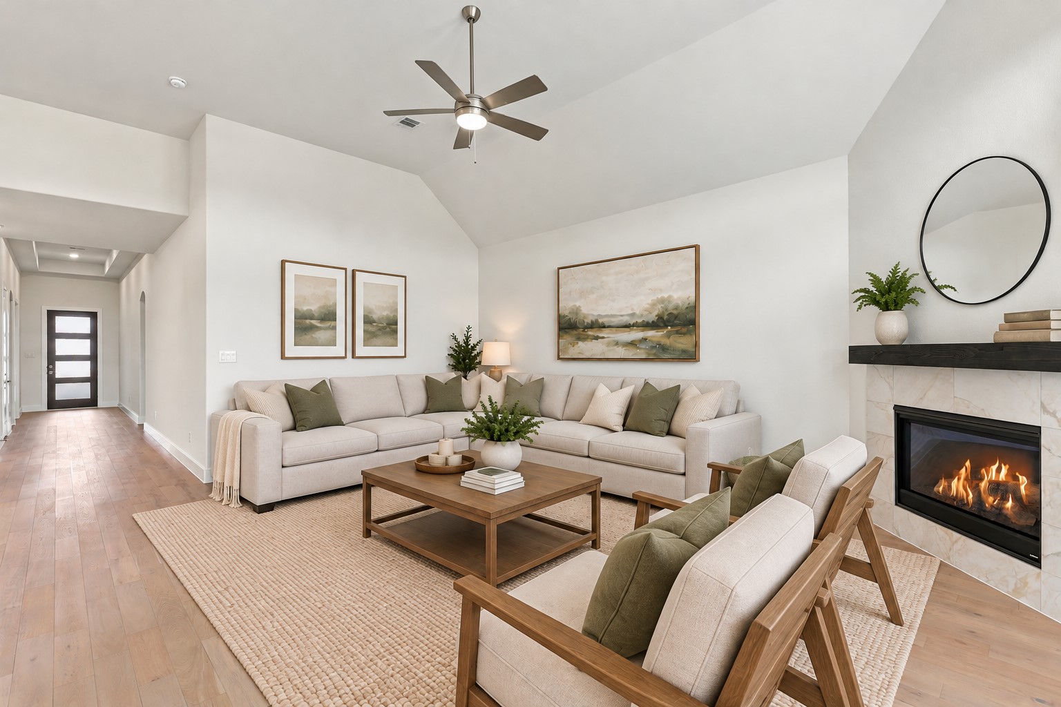 THE HEART OF THE HOME & A TRUE SHOWSTOPPER! This INVITING family room features a charming gas-log fireplace, soaring ceilings, and a ceiling fan for added comfort! Natural light fills the space, highlighting the beautiful flooring and neutral finishes! Imagine cozy evenings by the fire, gathering with loved ones, and enjoying the comfort of this WONDERFUL living space! **Photo is Virtually Staged**