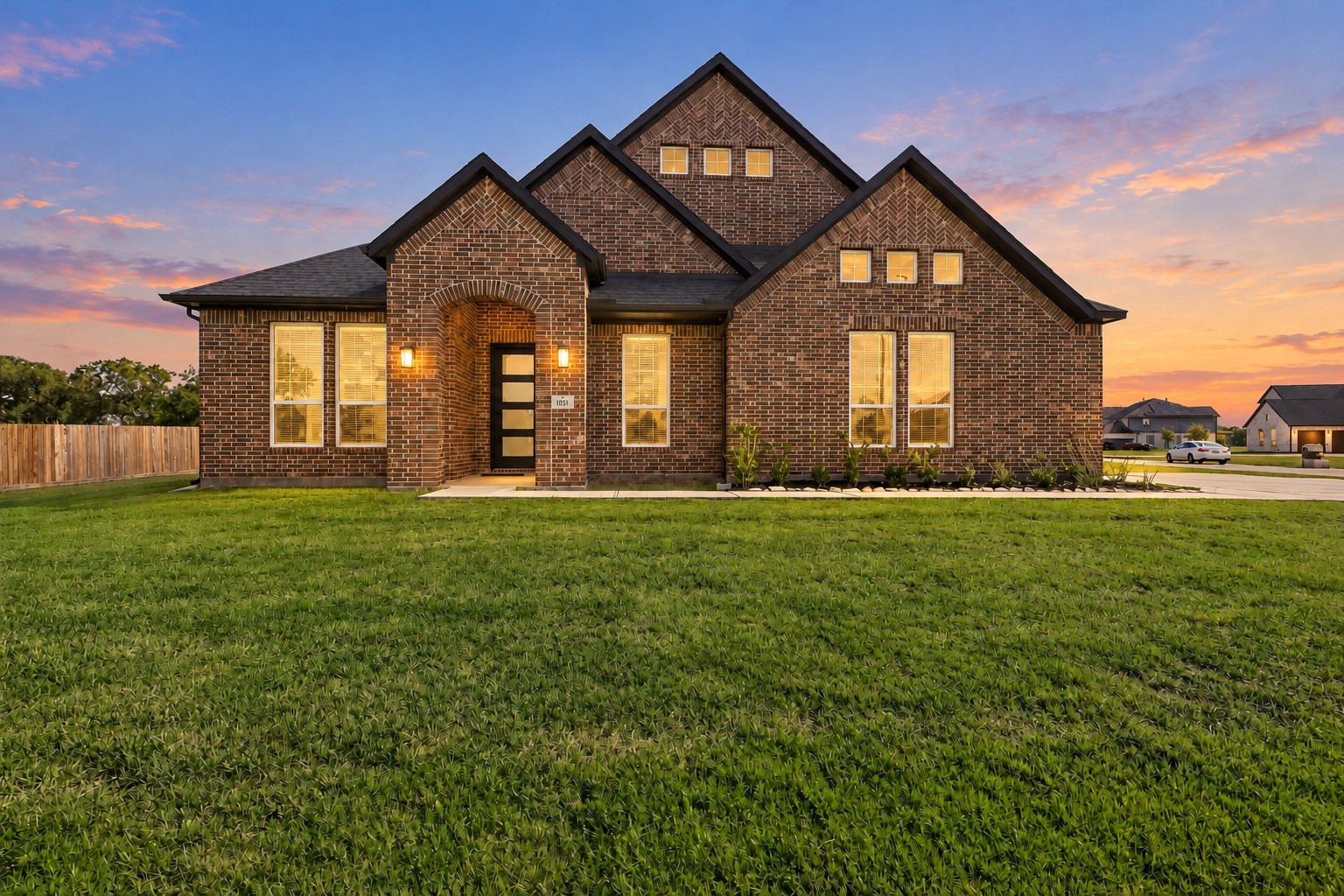 WOW! CURB APPEAL AT ITS FINEST! Prepare to FALL IN LOVE with this beautiful new all brick home by CastleRock Community Homes featuring striking architectural details, a welcoming covered front entry, and a SPACIOUS, beautifully maintained lawn! The warm glow of the windows creates an inviting atmosphere! A BEAUTIFUL first impression!