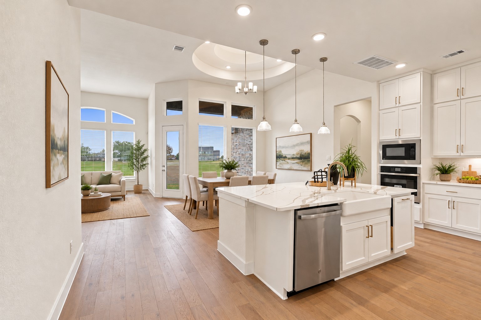 WHAT A TIMELESS OPEN FLOOR PLAN! This STUNNING GOURMET KITCHEN is designed for STYLE, COMFORT & EVERYDAY CONVENIENCE! Notice the BEAUTIFUL DEEP FARMHOUSE SINK and CLEVER PULL-OUT TRASH CABINET that keeps everything neatly tucked away! The SPECTACULAR OPEN DESIGN flows effortlessly into the living and dining areas, making entertaining a BREEZE! A WONDERFUL SPACE for gathering homemade cooking & creating lasting memories! Photo is Virtually Staged.