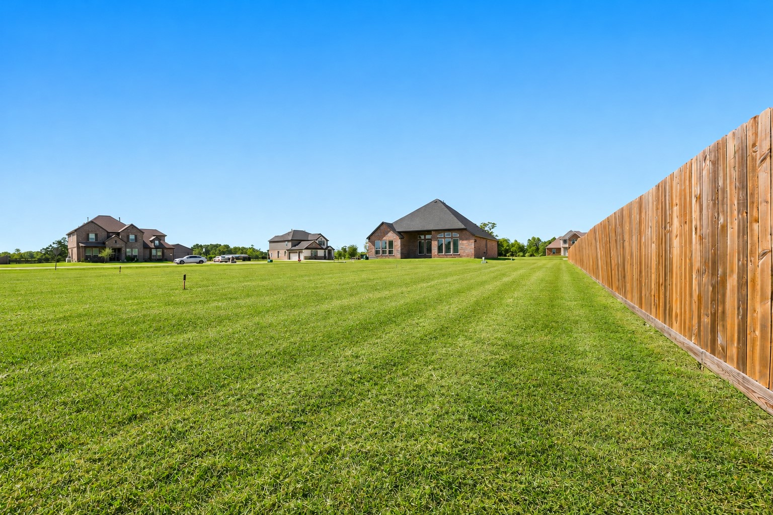 YOUR OWN BACKYARD PARADISE AWAITS! Just LOOK at that EXPANSIVE GREEN LAWN stretching along the side & rear of this BEAUTIFUL HOME! Imagine the ENDLESS POSSIBILITIES for outdoor entertaining, gardening, or simply enjoying all that WONDERFUL OPEN SPACE! Notice the UPGRADED ALL-BRICK EXTERIOR ON ALL FOUR SIDES, offering TIMELESS BEAUTY & LESS EXTERIOR UPKEEP! Come home to PEACEFUL COUNTRY-STYLE LIVING, relax beneath the EVENING STARS & enjoy the beauty of nature! ROOM TO ROAM, RELAX & MAKE MEMORIES!