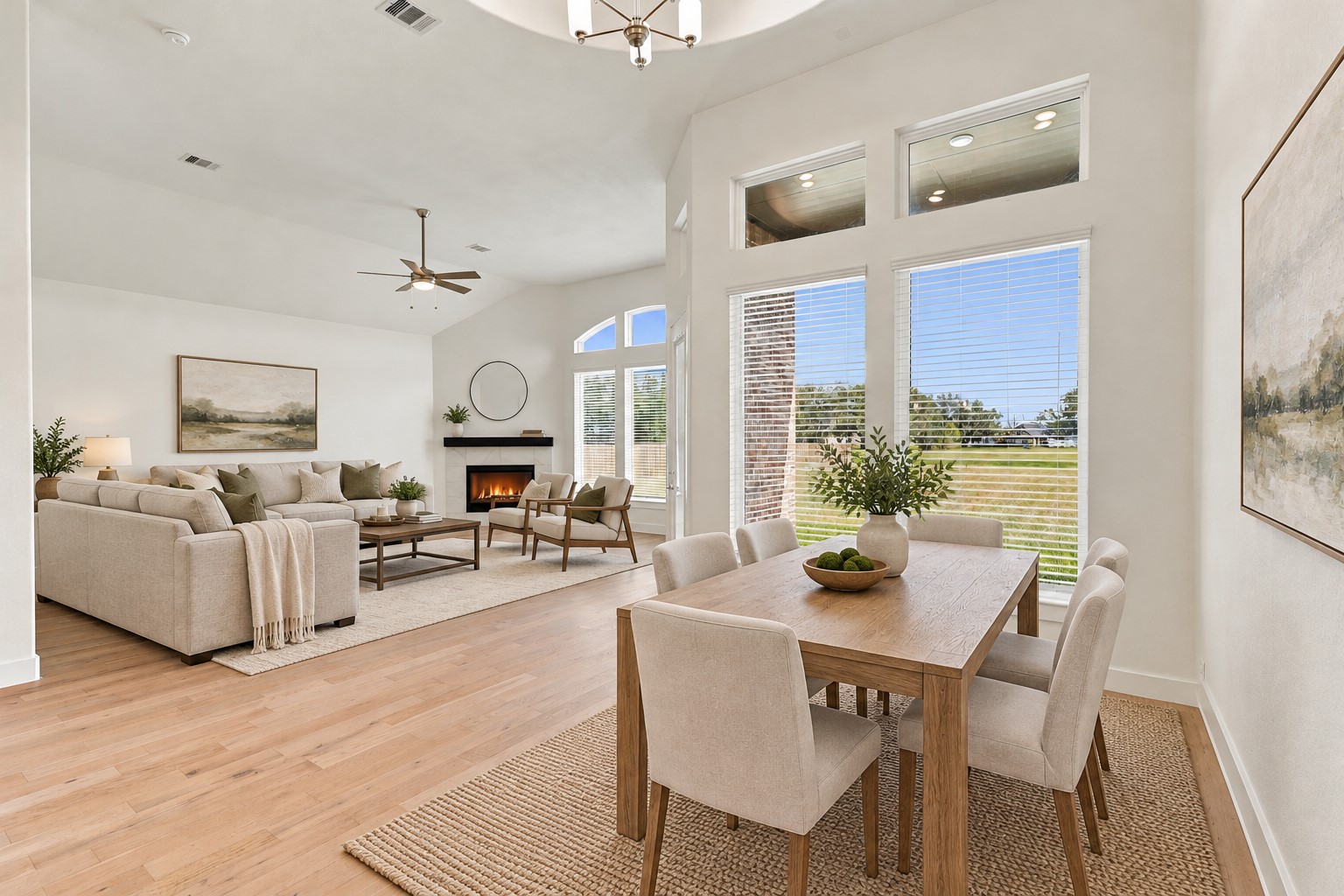 OPEN-CONCEPT LIVING AT ITS FINEST! FALL IN LOVE with this SPECTACULAR FAMILY ROOM featuring SOARING CEILINGS, DRAMATIC ARCHED WINDOWS & GORGEOUS ENGINEERED WOOD FLOORING! The spacious design flows beautifully into the inviting dining area, creating the PERFECT setting for entertaining & everyday living! BEST OF ALL, enjoy BEAUTIFUL VIEWS of your IMPRESSIVE ONE-ACRE PROPERTY! Imagine relaxing with loved ones while taking in the peaceful country-style setting! A DREAM HOME FOR MAKING MEMORIES! Virtual stage