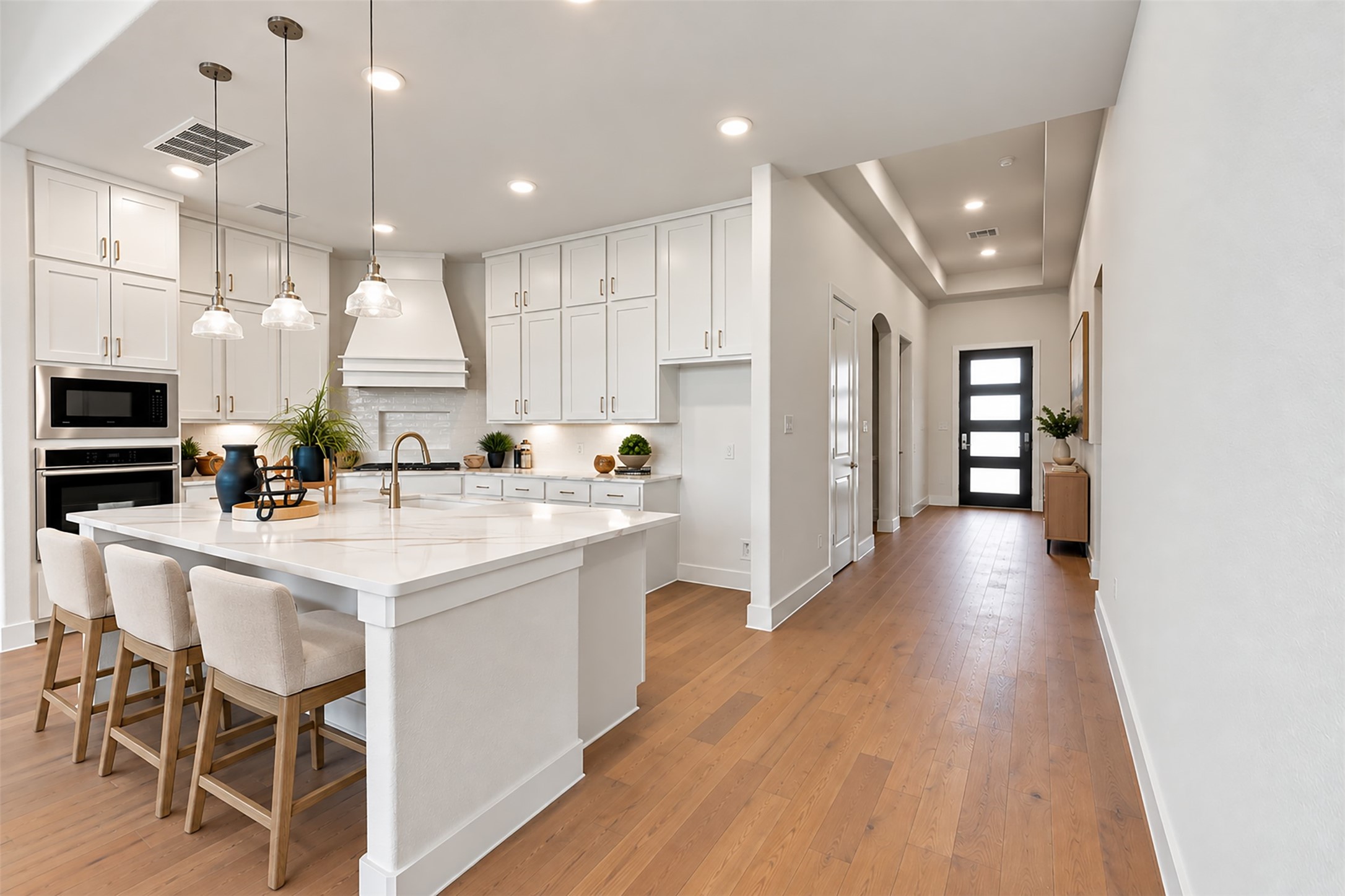 WHAT A DREAM GOURMET KITCHEN! Prepare to be AMAZED by the ABUNDANCE OF BEAUTIFUL CABINETRY & GORGEOUS QUARTZ COUNTERTOPS offering incredible space for cooking & entertaining! Notice the ELEGANT SWAN-NECK PULL-OUT FAUCET, DEEP UNDERMOUNT SINK & STUNNING PENDANT LIGHTING that adds a designer touch! BEAUTIFUL UPGRADED FLOORING completes this SPECTACULAR SPACE! A KITCHEN YOU'LL LOVE COMING HOME TO! Photo is Virtually Staged.