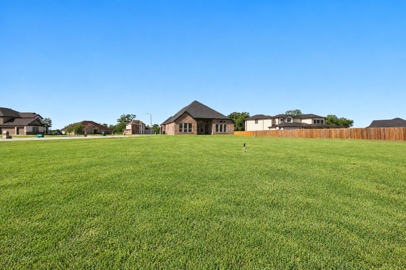 WOW! LOOK AT ALL THAT BEAUTIFUL GREEN SPACE! Prepare to be AMAZED by this EXPANSIVE backyard offering wonderful possibilities for outdoor entertaining, gardening, recreation, or creating your very own backyard paradise! Situated on approximately ONE ACRE, this property provides an incredible amount of outdoor space to make your dreams a reality! LET YOUR IMAGINATION RUN WILD!