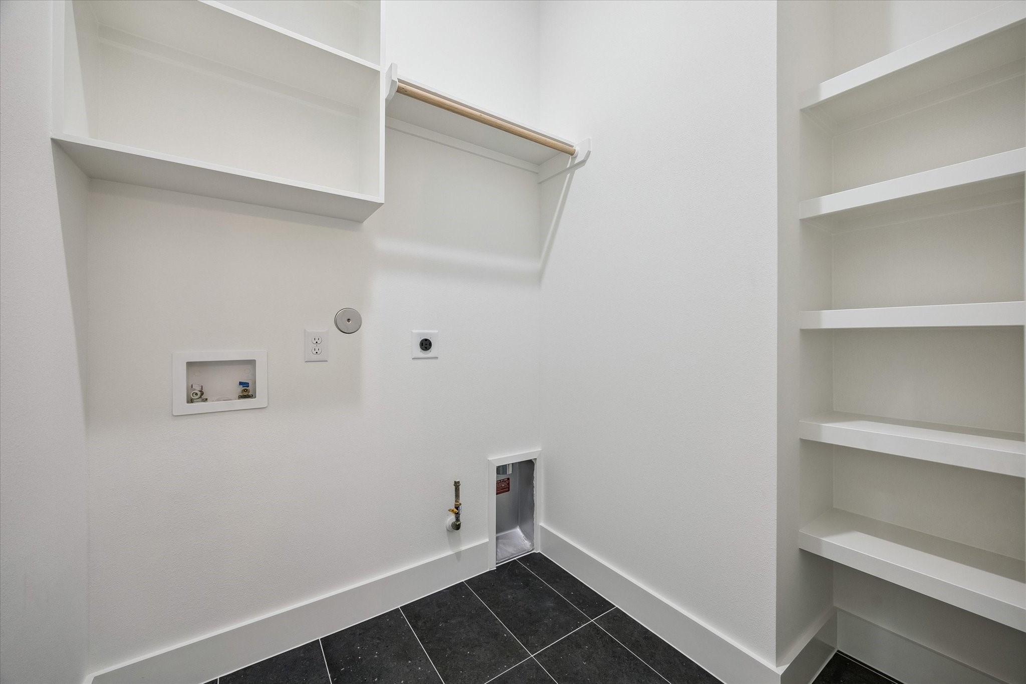 Utility area with built-in storage and clean laundry functionality