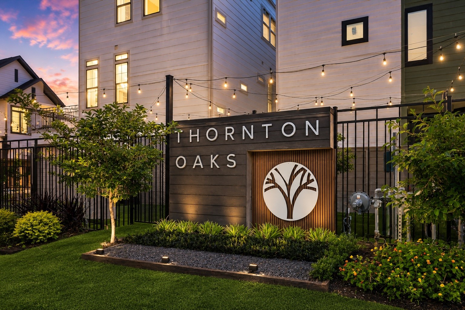 Thornton Oaks entry monument with lush landscaping and boutique identity