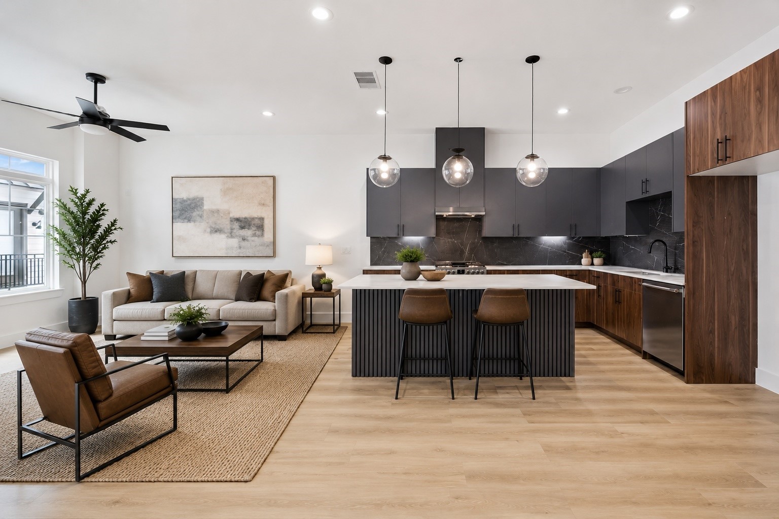 Showpiece kitchen with waterfall-style island, pendants, and wood accents Showpiece kitchen with waterfall-style island, pendants, and wood accents