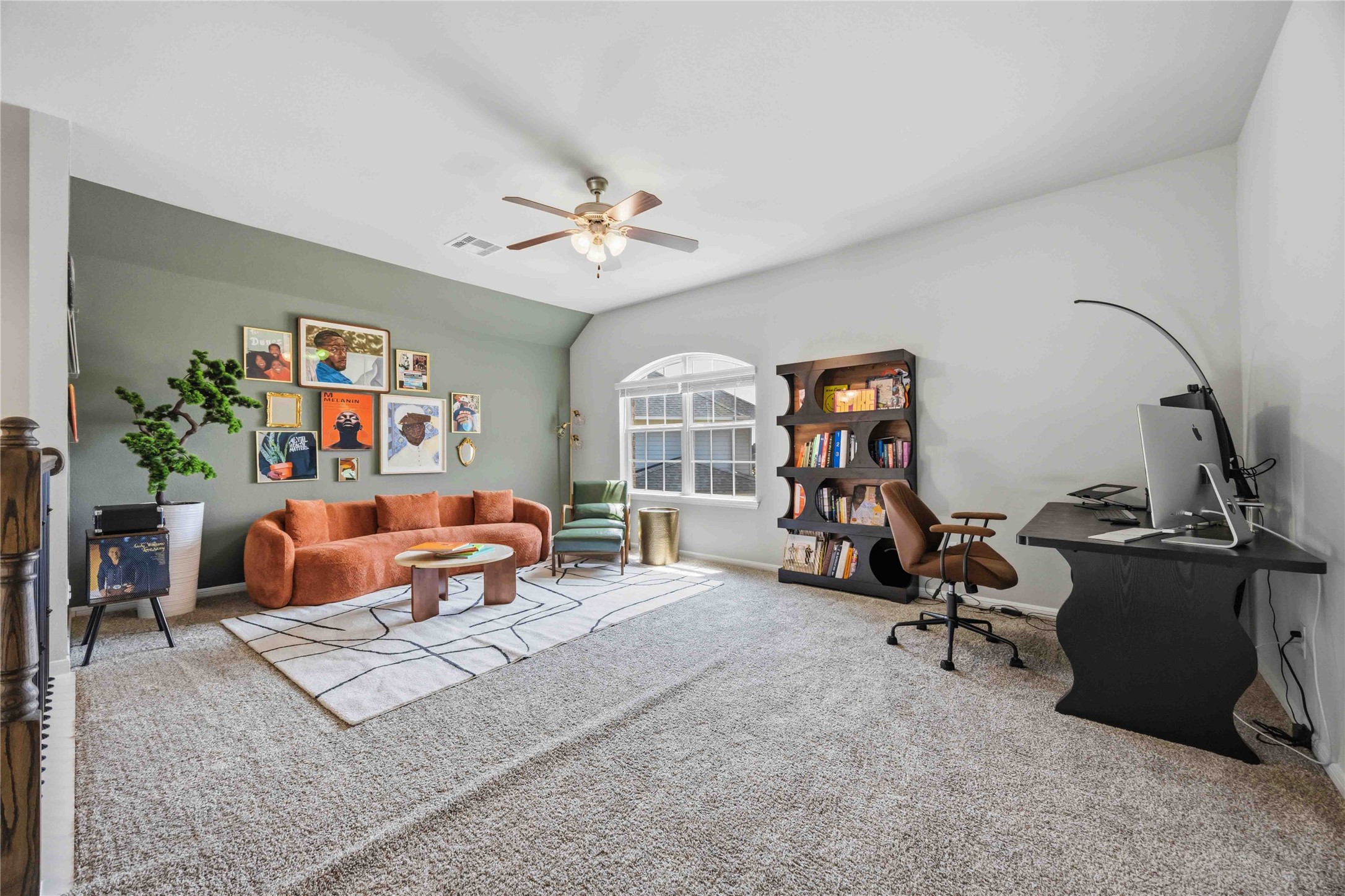 Ceiling fan and natural light make this flex space inviting.