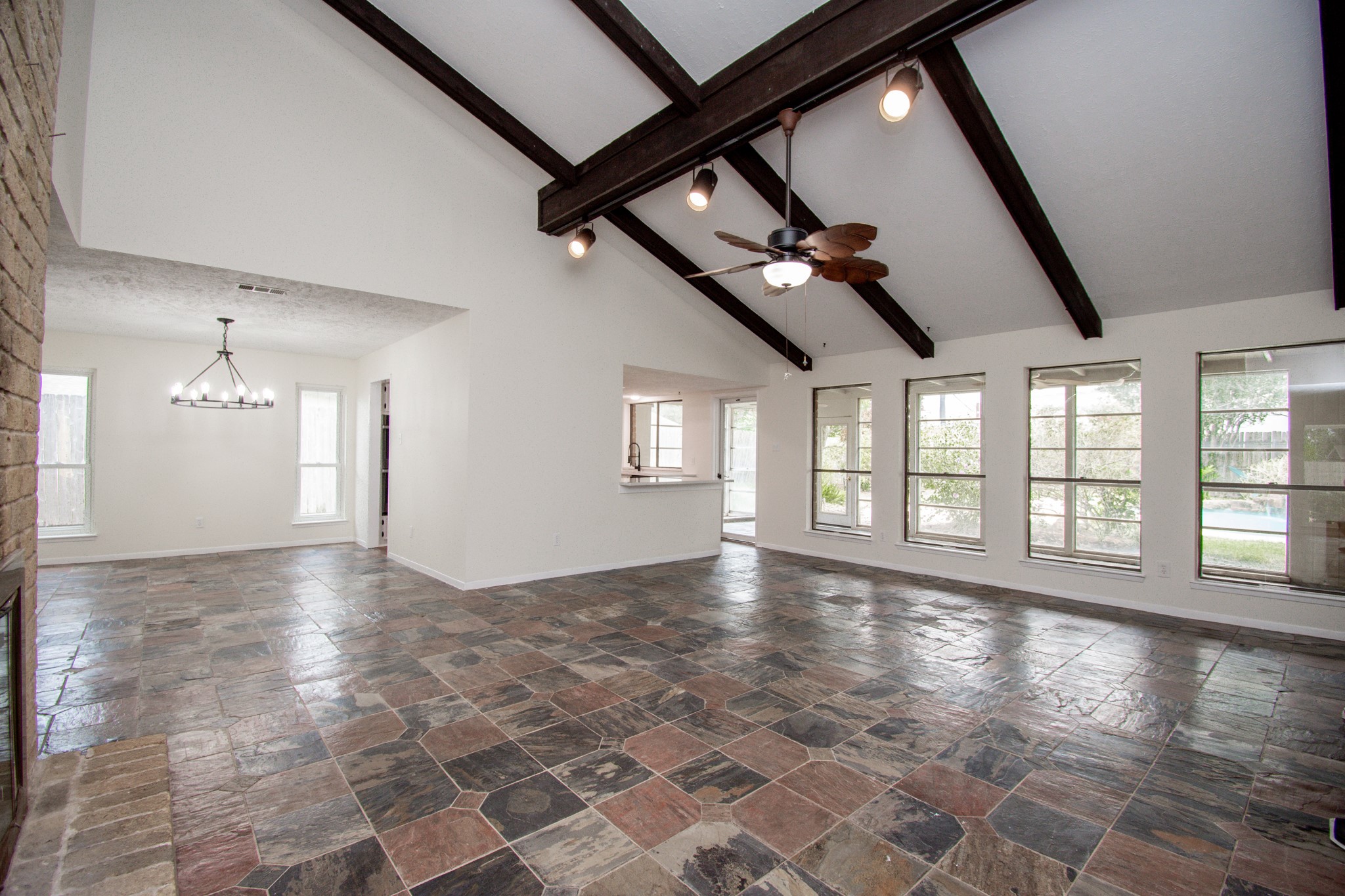 Wall of windows show off the enclosed sunroom!