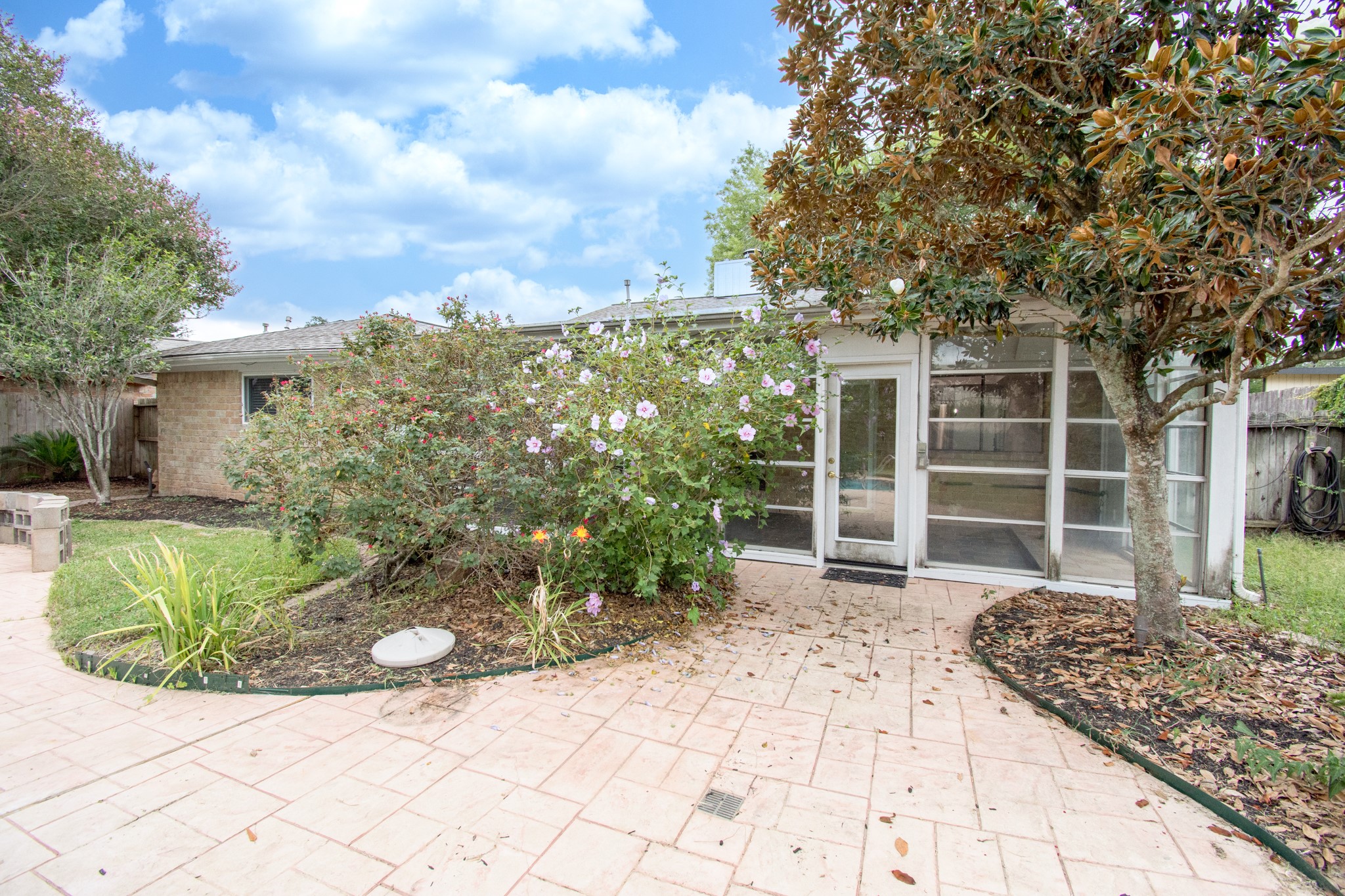 Sprinkler system, extensive stamped concrete decking and mature trees!