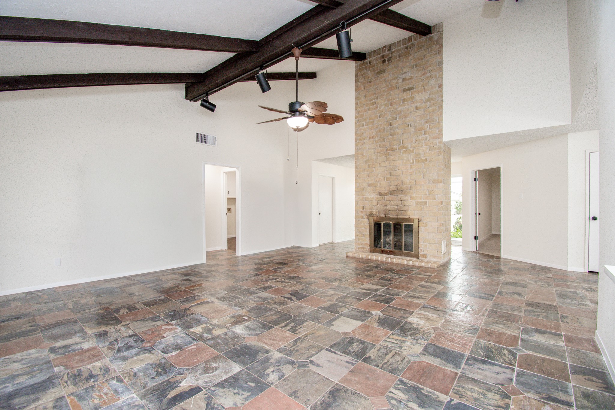 High ceilings and a brick fireplace!