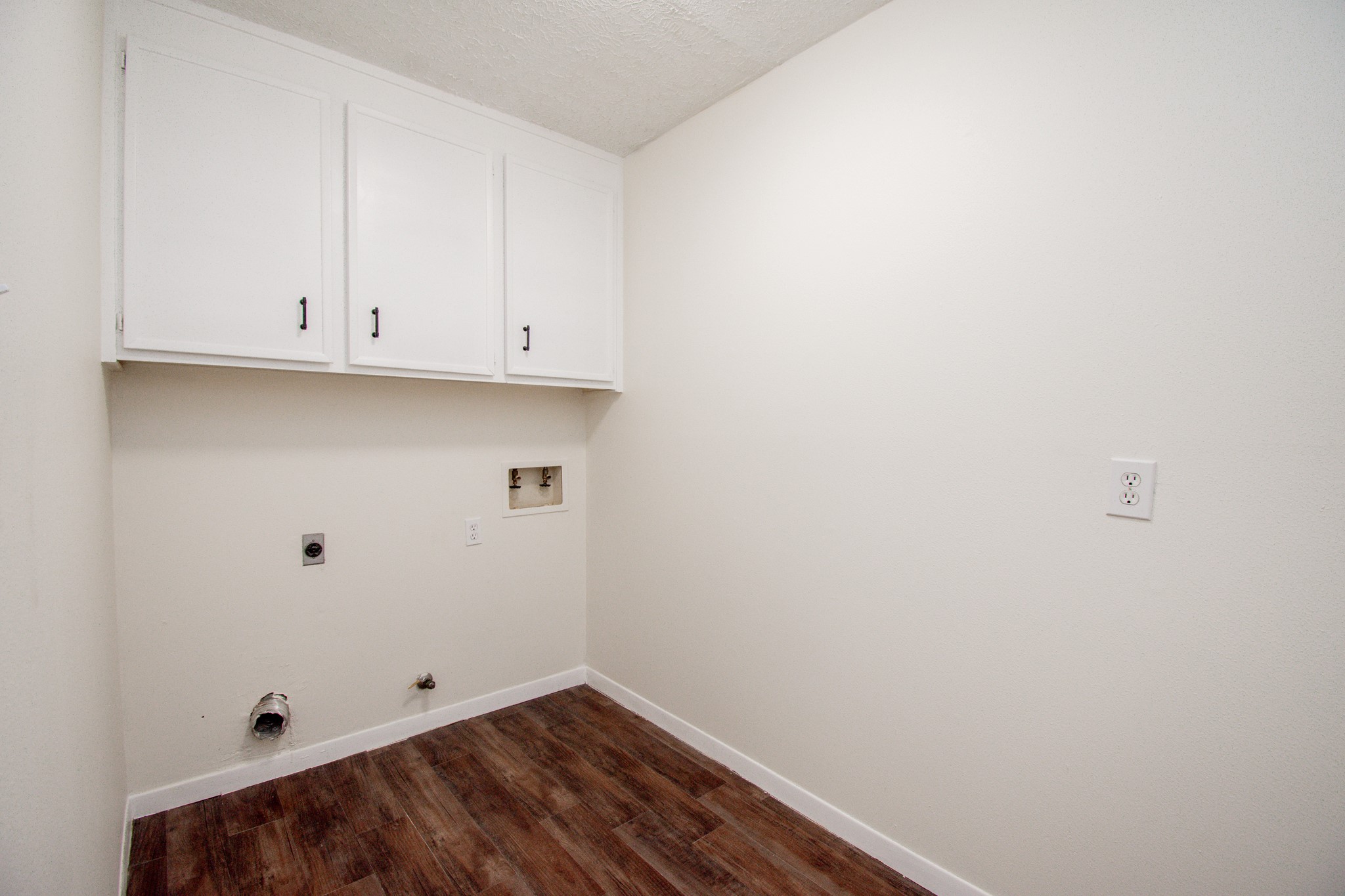 Laundry Room with cabinet storage