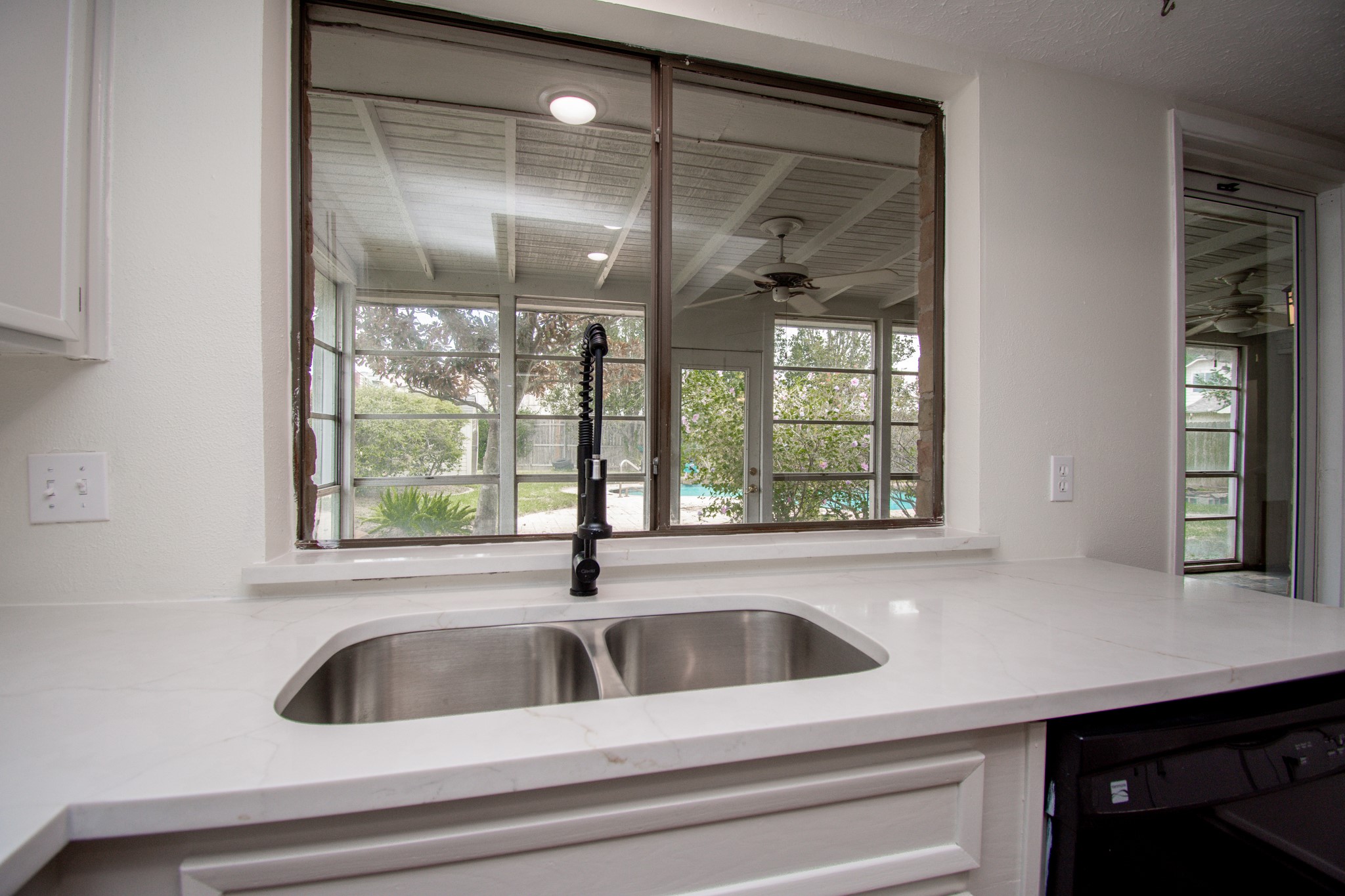 New Quartz counters, double sided stainless undermount sink, new hardware and faucet.