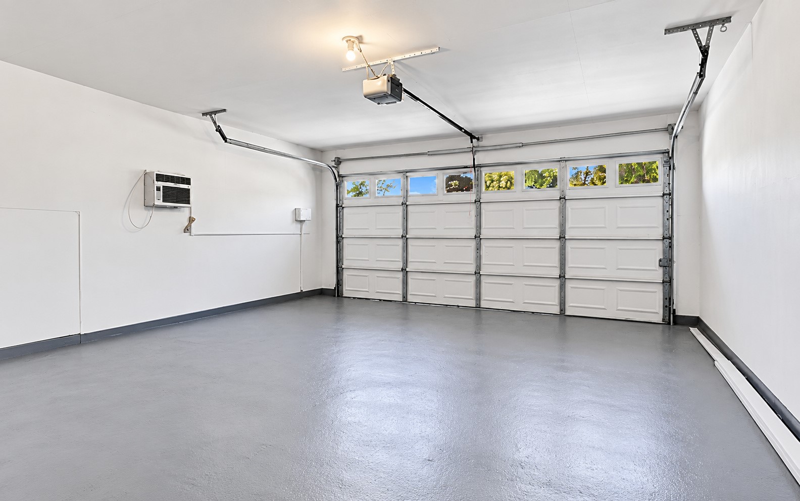 The two-car garage has a wall unit for comfort!