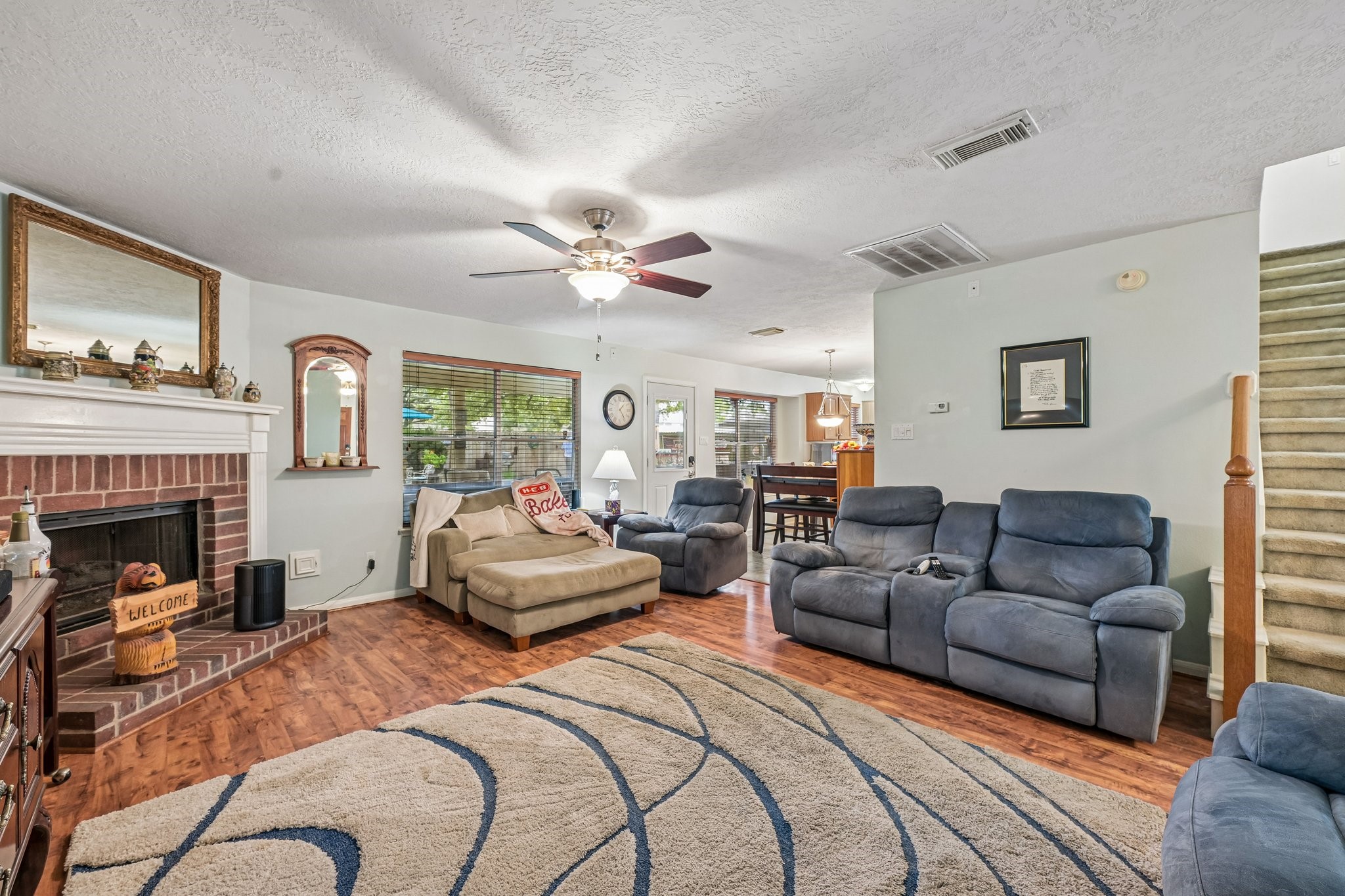 Open family area seamlessly connecting to the entryway and staircase, perfect for everyday living and entertaining. Open family area seamlessly connecting to the entryway and staircase, perfect for everyday living and entertaining.