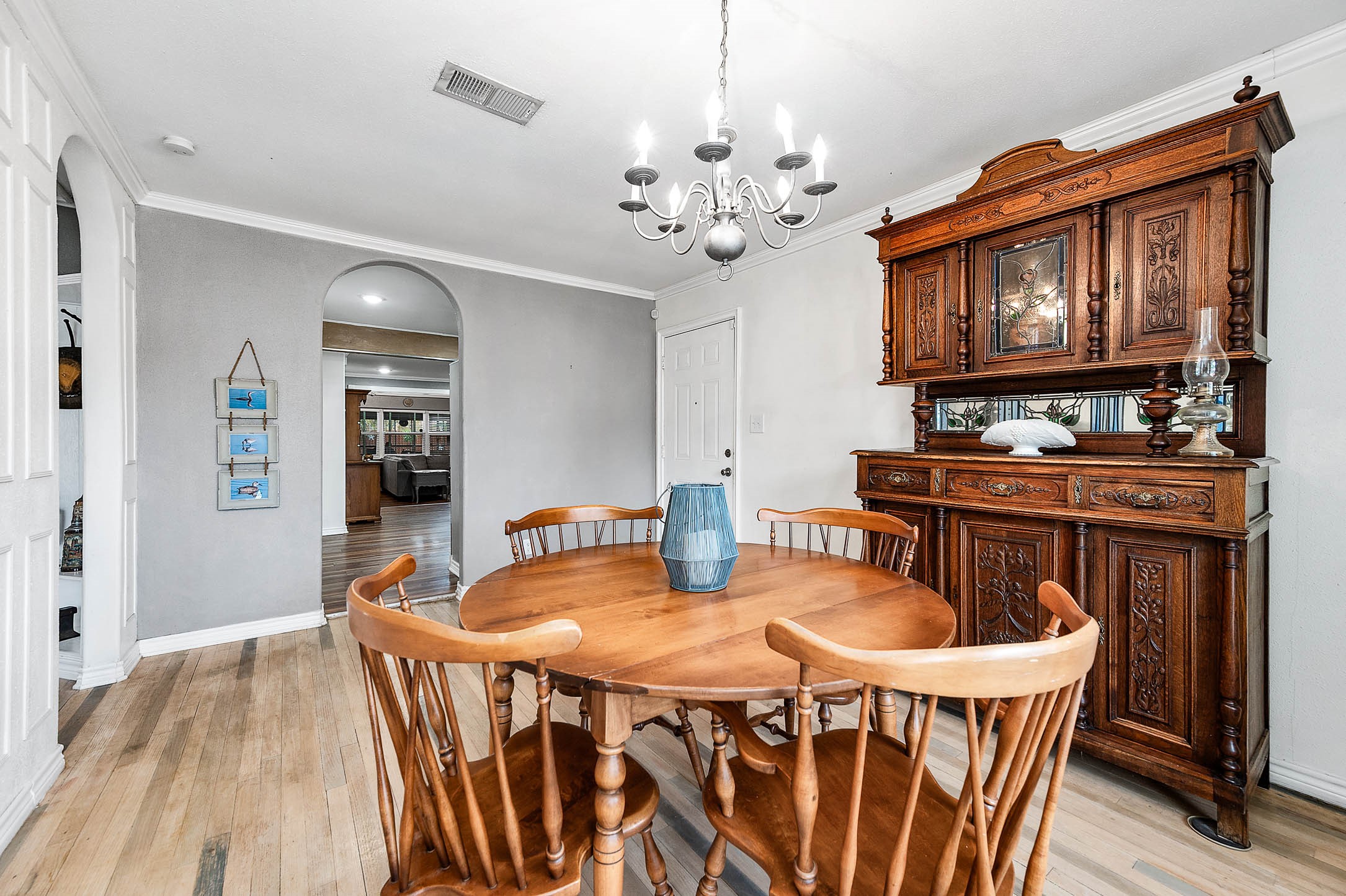 Original oak flooring adds character to the front dining/flex room.