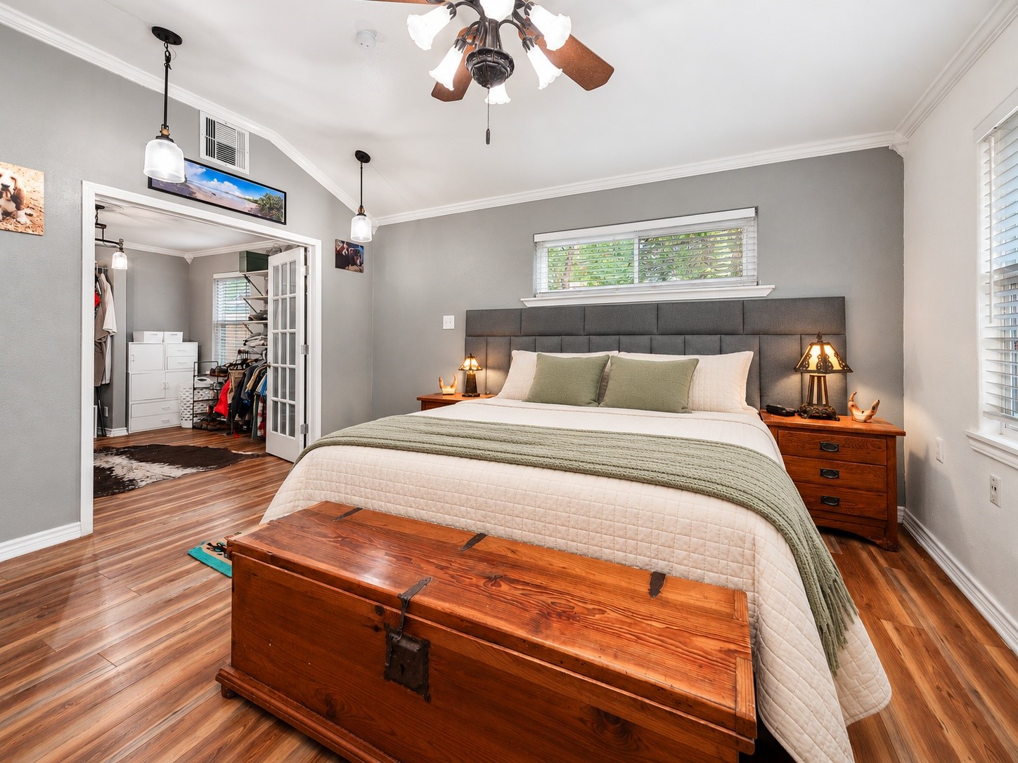 Primary bedroom with French doors leading to the large walk-in closet.