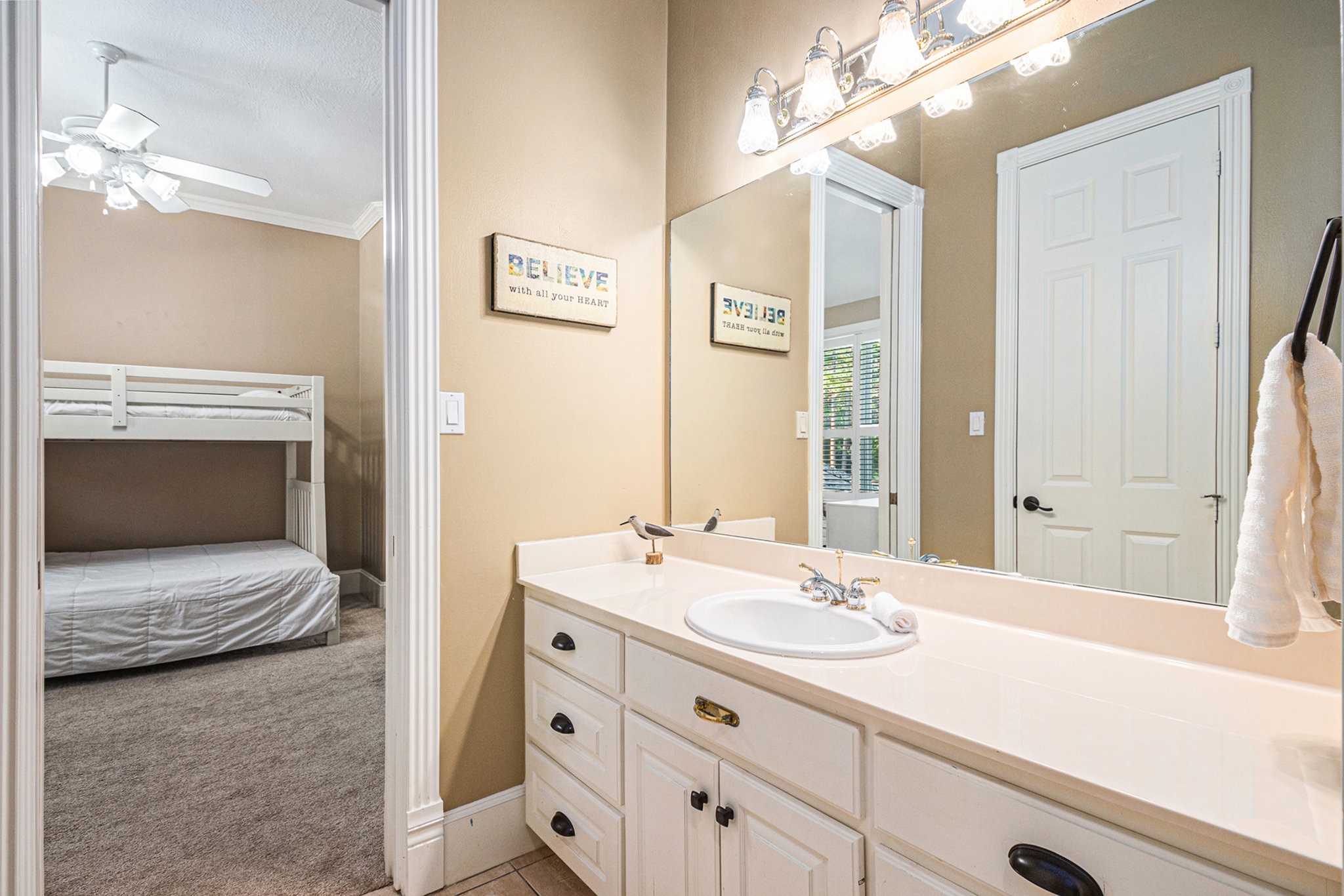 View of the Hollywood bathroom with tons of under cabinet storage.