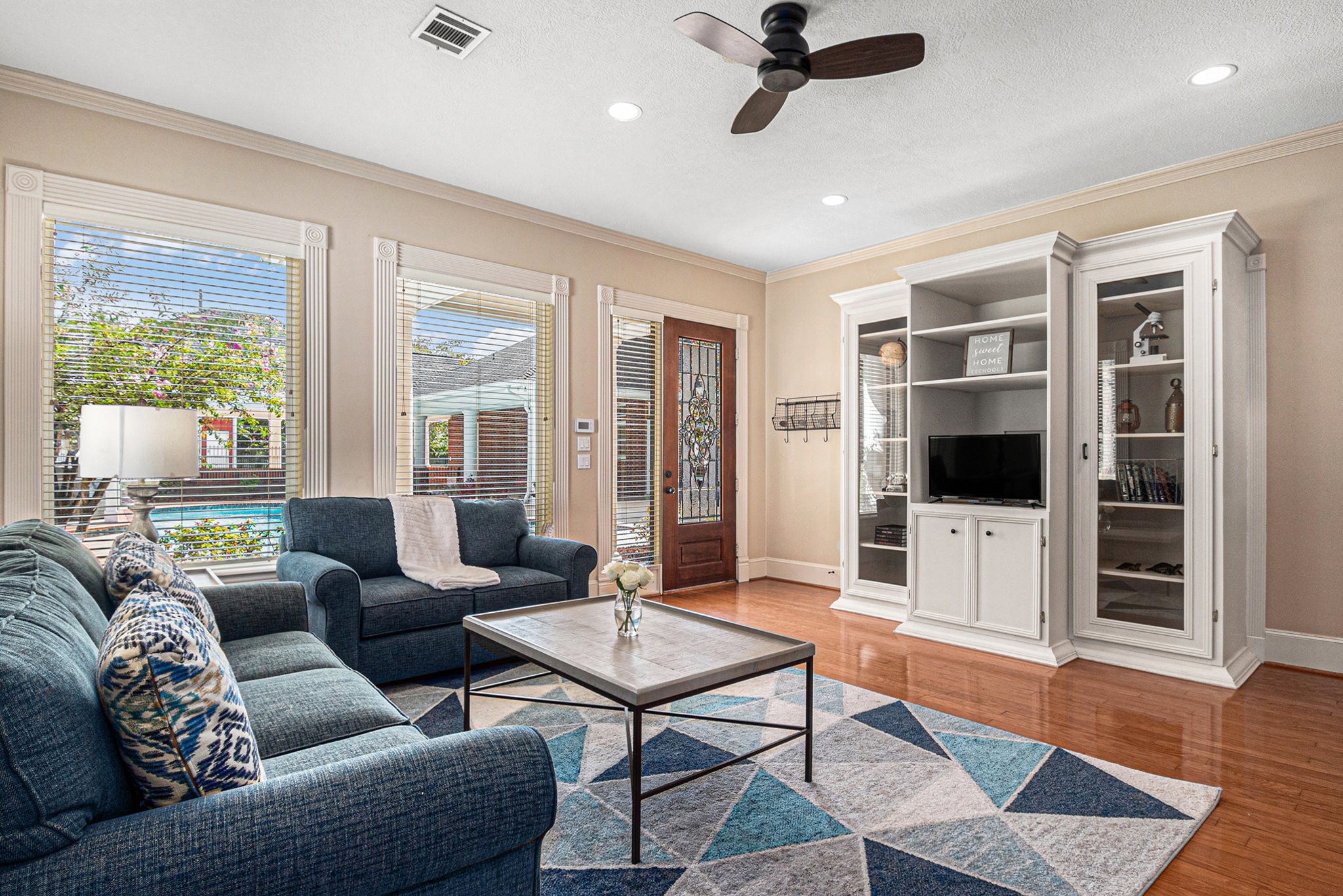 Beautiful living room in the guest house with stunning views of the backyard.