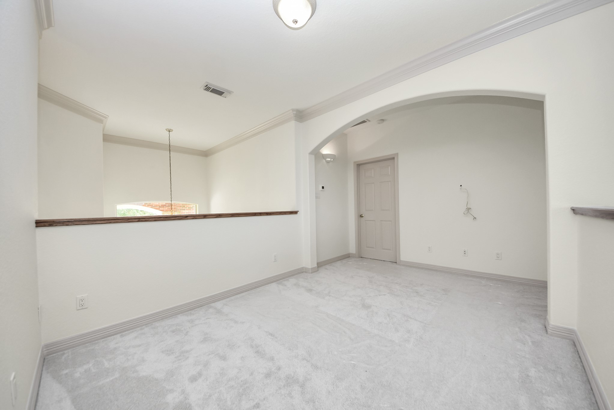 Upstairs gameroom overlooking the living room and entry.