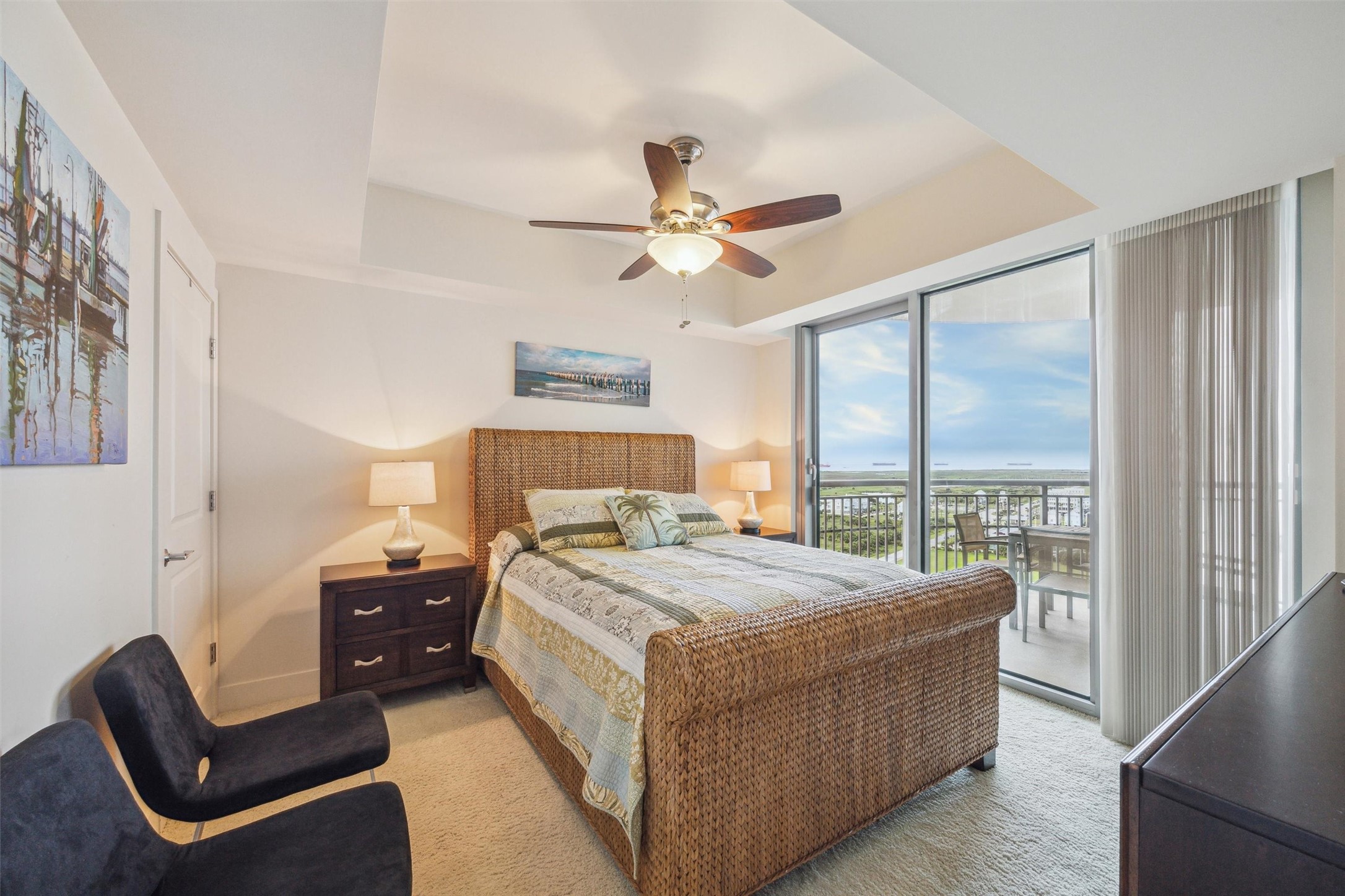 Bedroom 2 with bay views opens to balcony