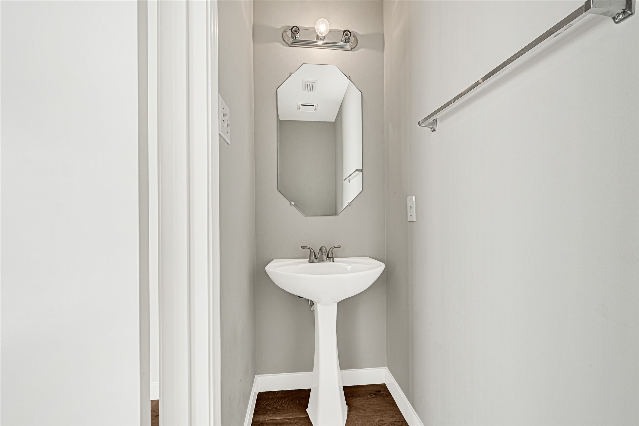 Half bath located on first floor, perfect for guests.