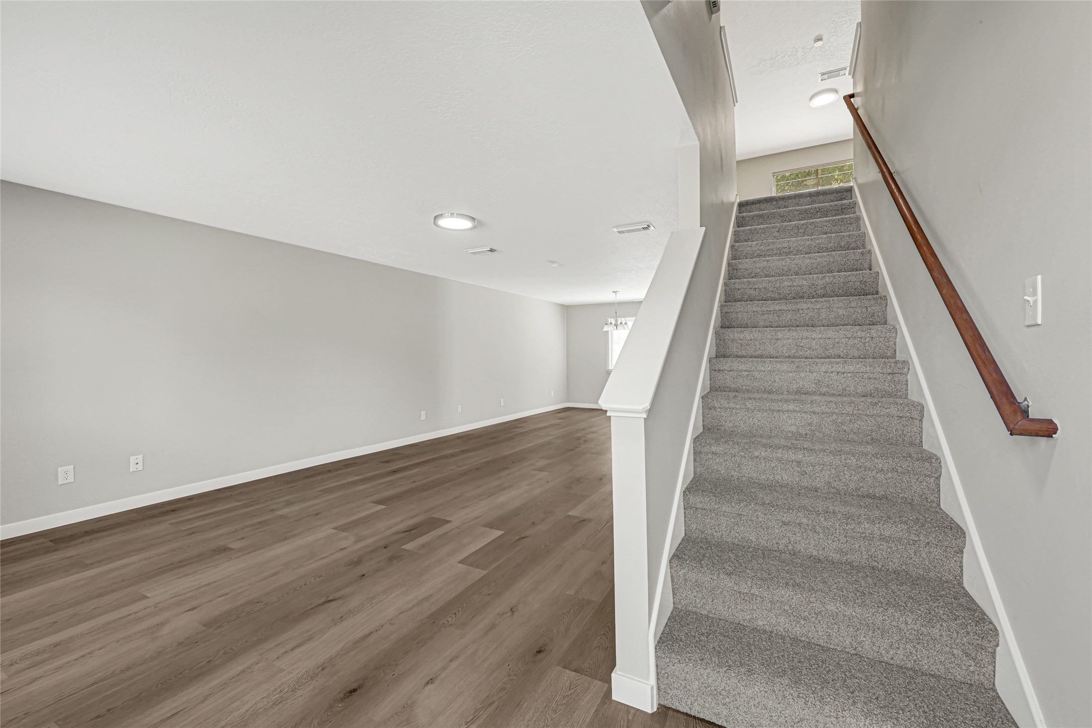 Entryway opening into the main living space, offering plenty of space for relaxation. This inviting area features an open-concept layout that seamlessly connects the front entrance to the primary living quarters, perfect for hosting guests or enjoying quiet evenings at home.