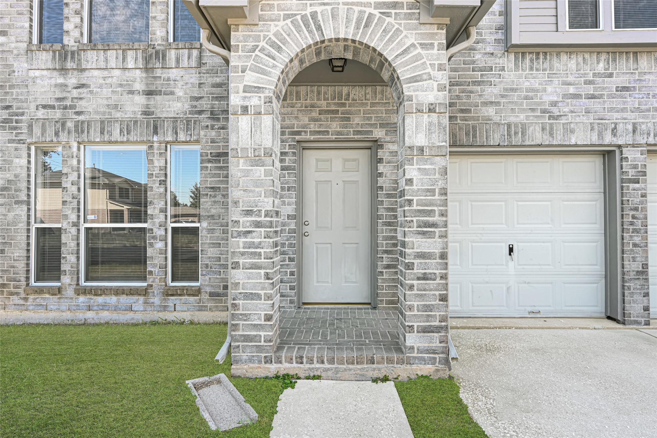 Inviting front entrance showcasing a seamless transition into the fully renovated interior.