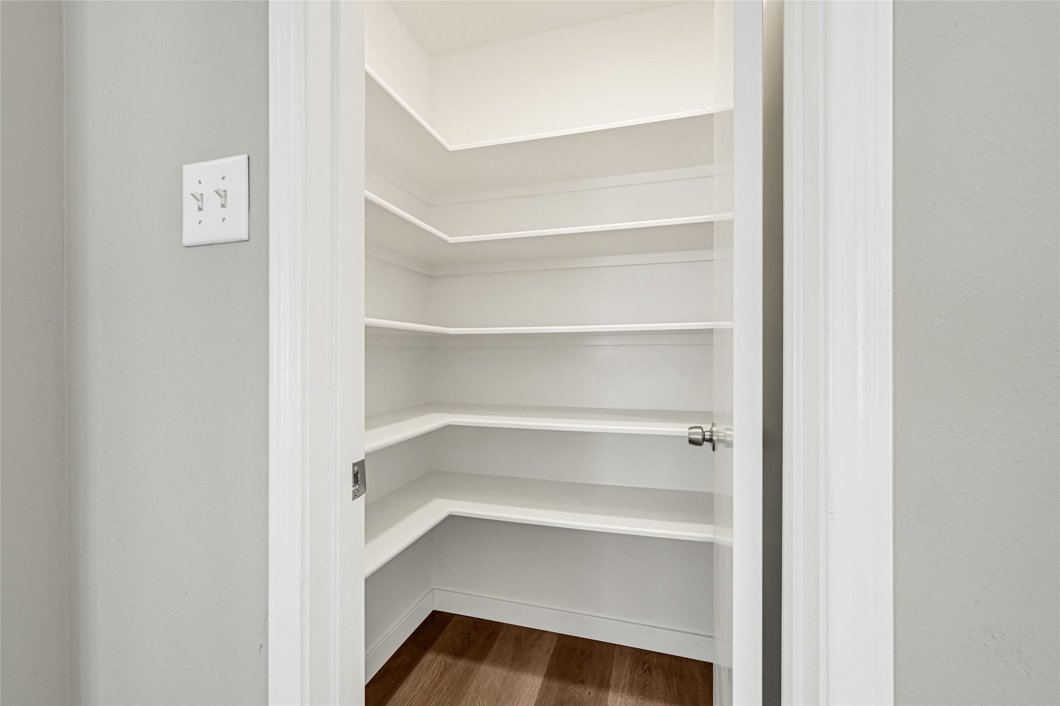 Got snacks? This walk-in pantry is a true organizational dream, offering expansive shelving that provides abundant space to neatly arrange all your dry goods and favorite treats