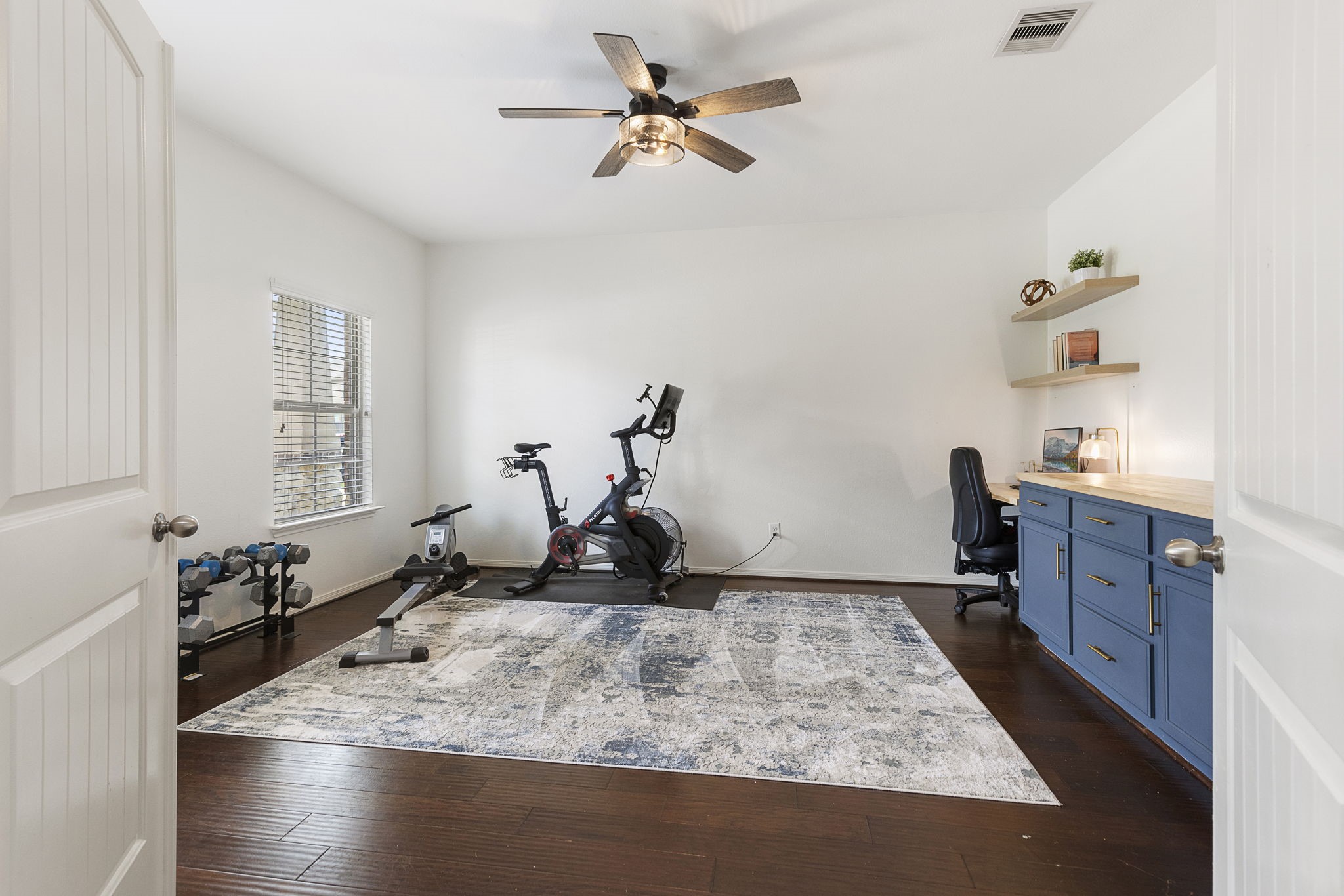 French doors lead to this private study that is large enough to home both your office needs and workout equipment!